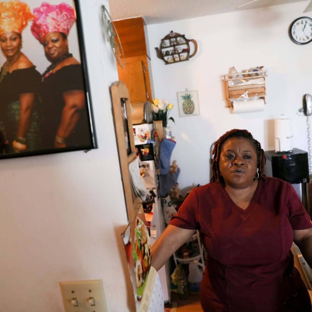 Deferred Enforced Departure status holder Marie Zar, who works as a nurse’s assistant, gets ready for work, in Brooklyn Center, Minnesota, on March 29, 2019.
