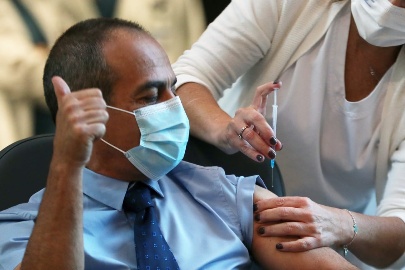 Dr. Ronni Gamzu is vaccinated against coronavirus as Israel kicks off its vaccination campaign, at Tel Aviv Sourasky Medical Center (Ichilov Hospital) in Tel Aviv, Israel on December 20, 2020.