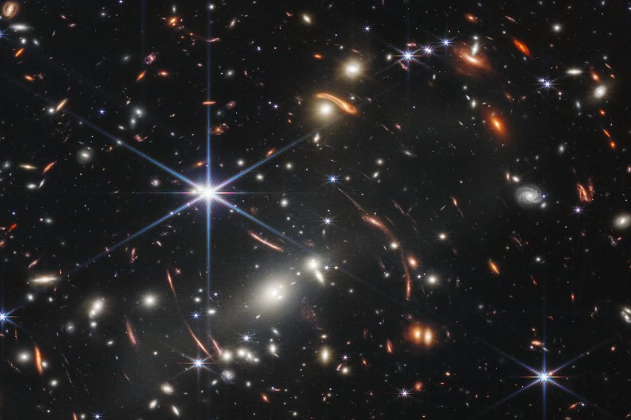 Thousands of galaxies flood this near-infrared image of galaxy cluster SMACS 0723. High-resolution imaging from NASA’s James Webb Space Telescope combined with a natural effect known as gravitational lensing made this finely detailed image possible. 