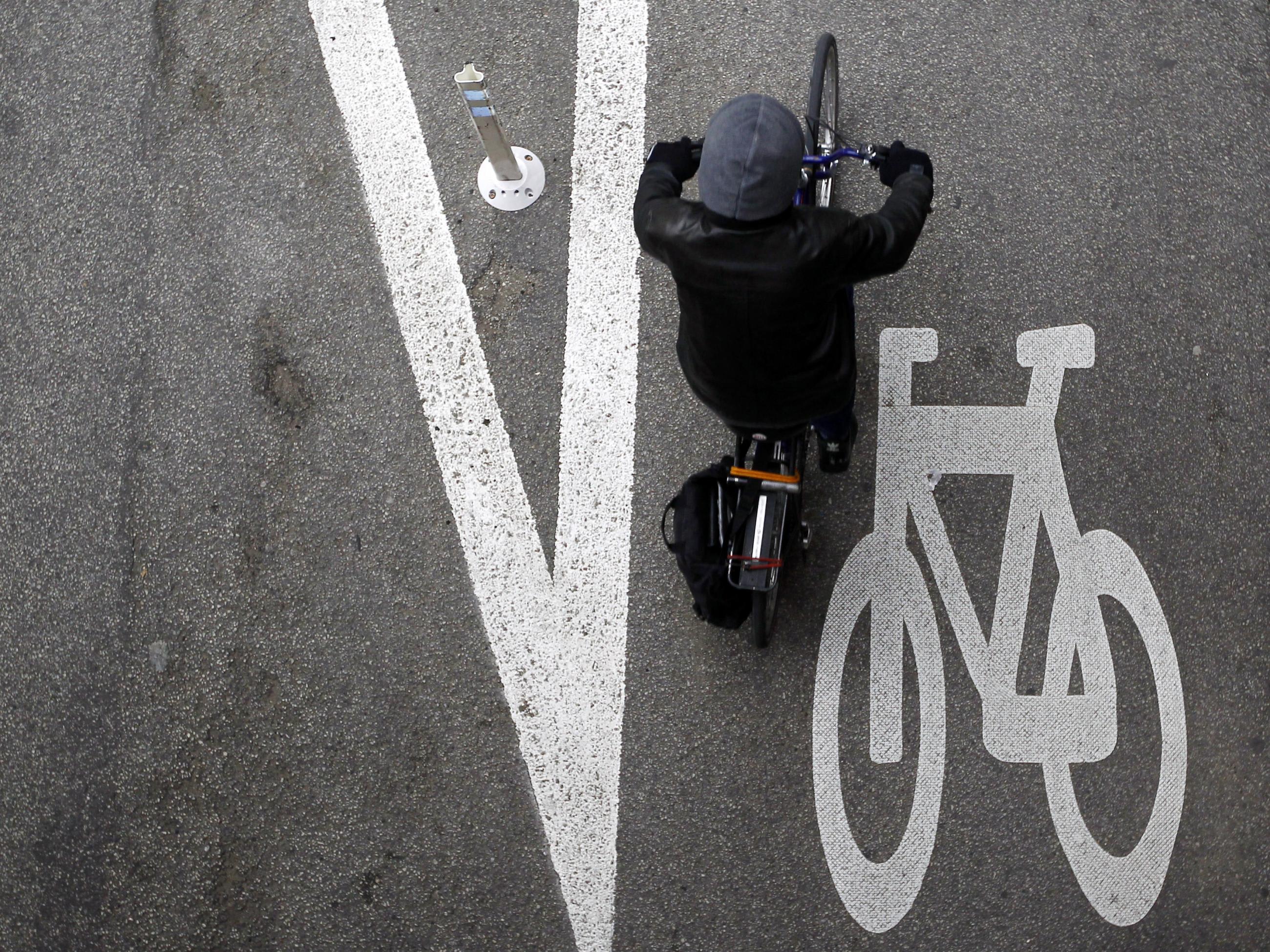 A cyclist rides along the Kinzie Protected Bike Lane in Chicago.