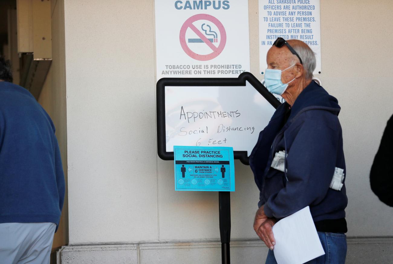 Seniors, who are 65 and over, wait in line at the Department of Health Sarasota COVID-19 Vaccination Clinic in Sarasota, Florida on January 4, 2021.