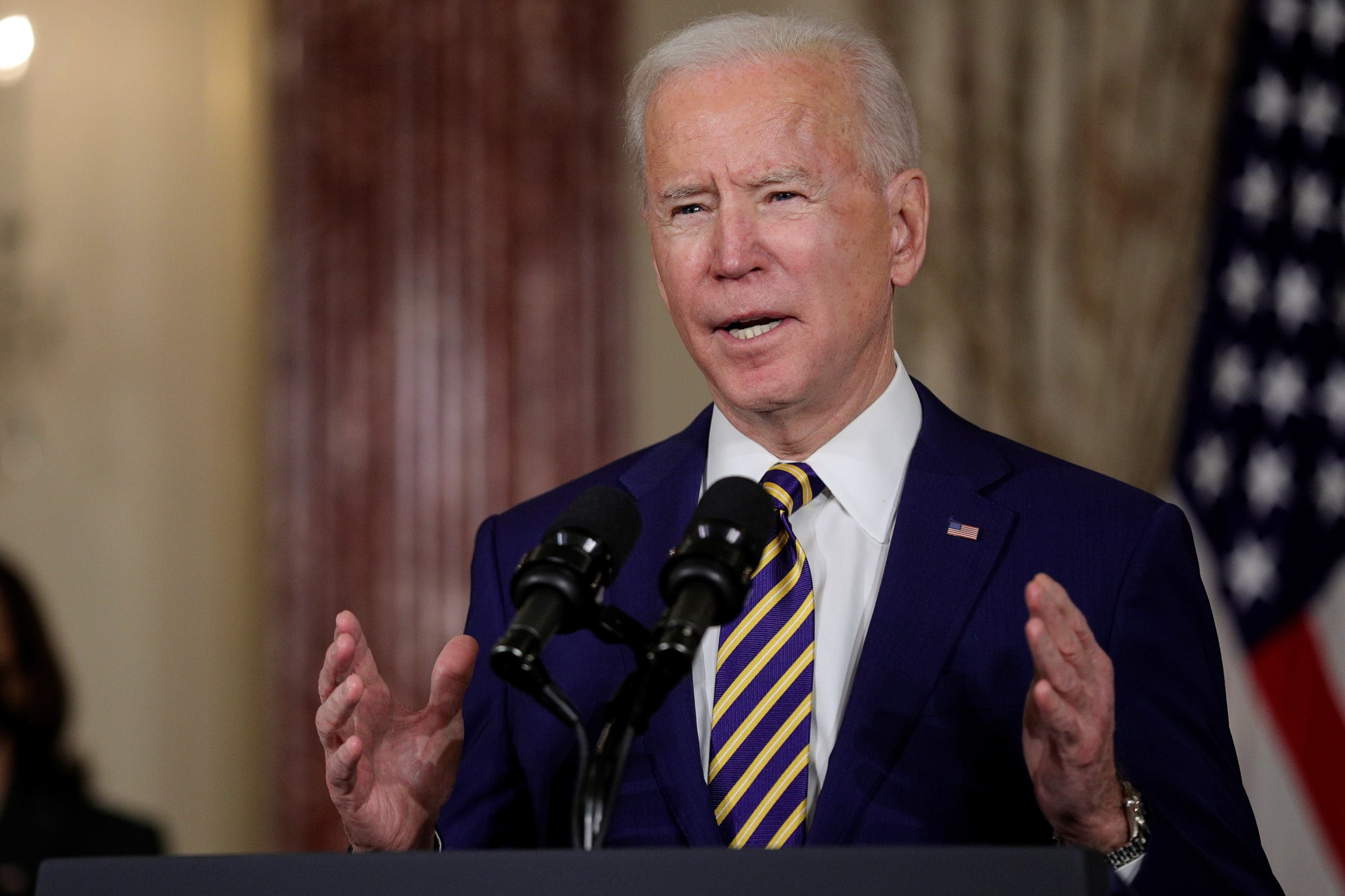 U.S. President Joe Biden delivers a foreign policy address as Vice President Kamala Harris listens, at the State Department in Washington, DC on February 4, 2021.