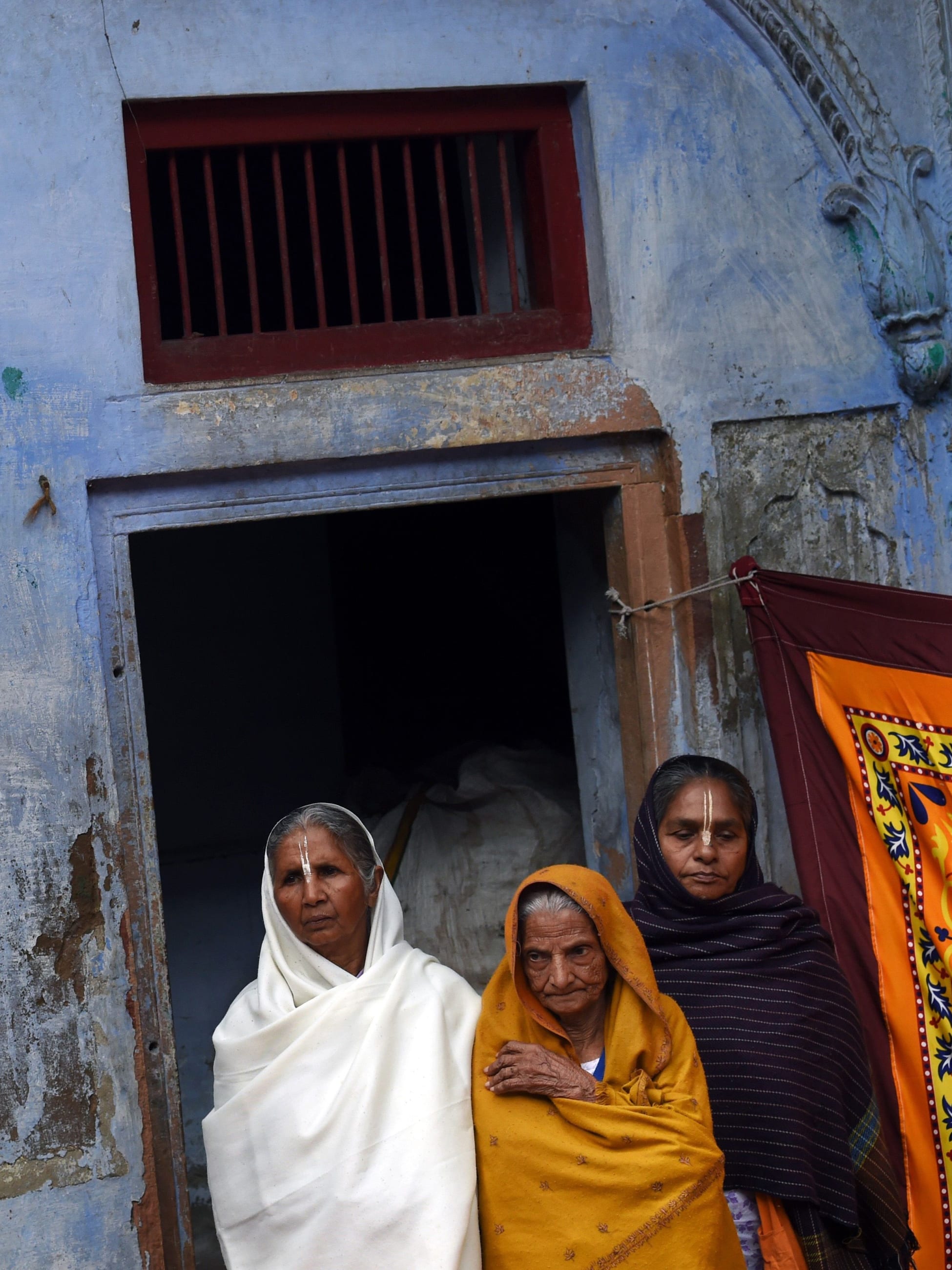Widows are seen in front of an ashram in Vindravan, India, on March 3, 2015. Almost 2,000 of the estimated 34 million widows currently living in India live in Vindravan.