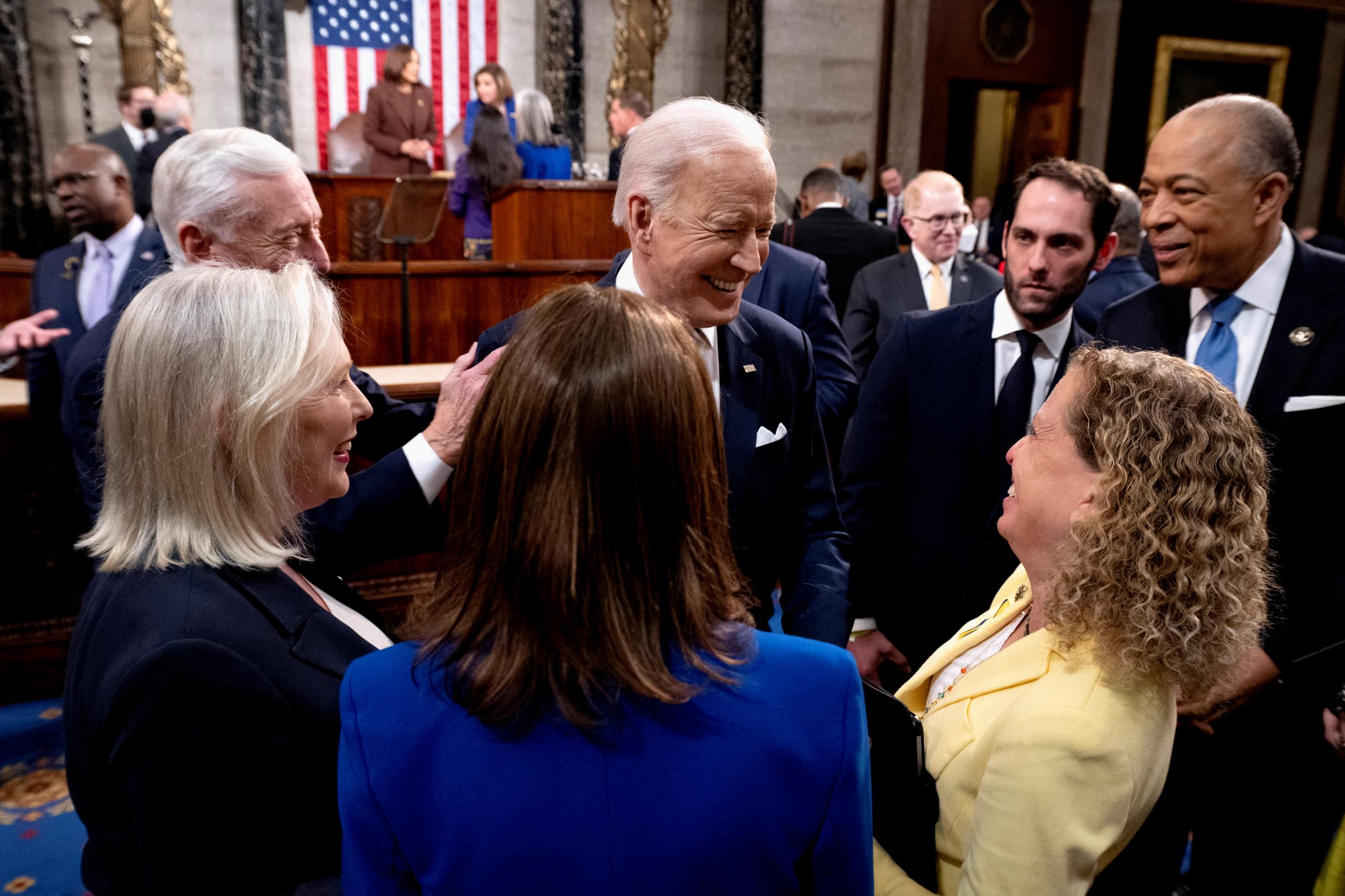 U.S. President Joe Biden speaks with members of Congress after delivering the State of the Union address to a joint session of Congress in Washington, DC, on March 1, 2022.
