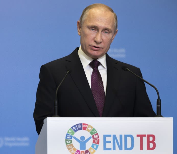 Russian President Vladimir Putin delivers a speech in front of a podium that says "End TB" during the Global Ministerial Conference, held by the WHO, with a bored expression on his face in Moscow, Russia, on November 16, 2017.