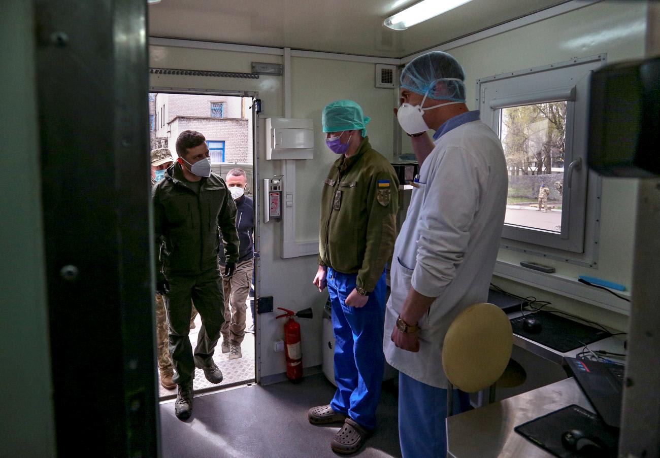 Ukrainian President Volodymyr Zelenskyy inspects a laboratory at a military mobile hospital following the opening of an infectious disease ward for COVID-19 patients, in Pokrovsk, Ukraine, on April 11, 2020.