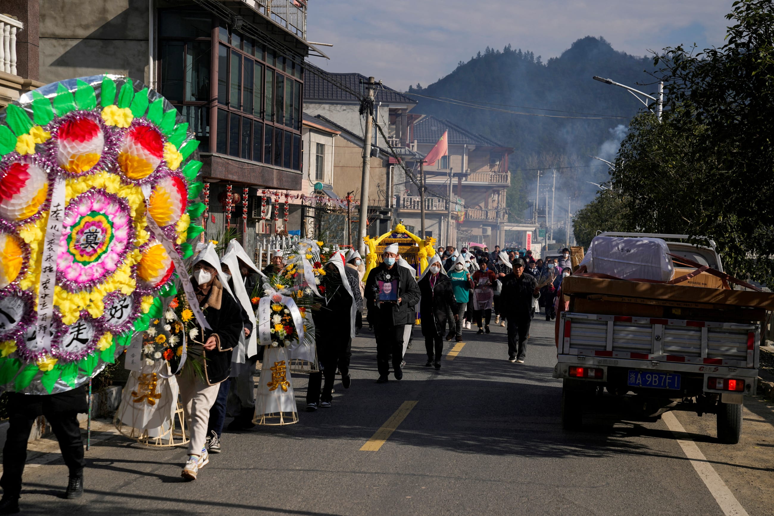 Relatives and neighbors attend the funeral of a woman surnamed Liu, as coronavirus disease (COVID-19) outbreak continues, at a village in Tonglu county, Zhejiang province, China, January 9, 2023. REUTERS/Aly Song