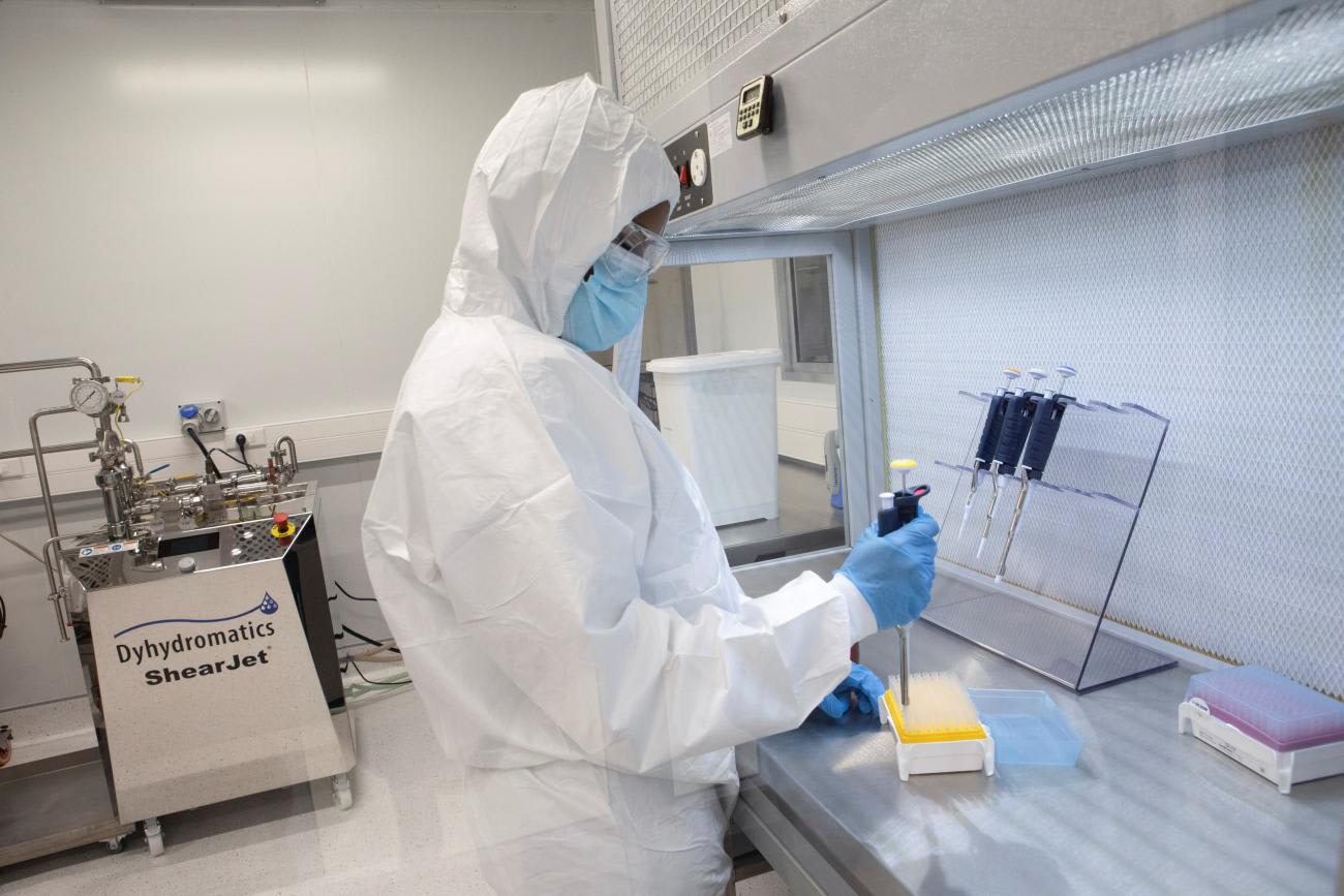 A production scientist works with samples at the Afrigen Biologics' site 