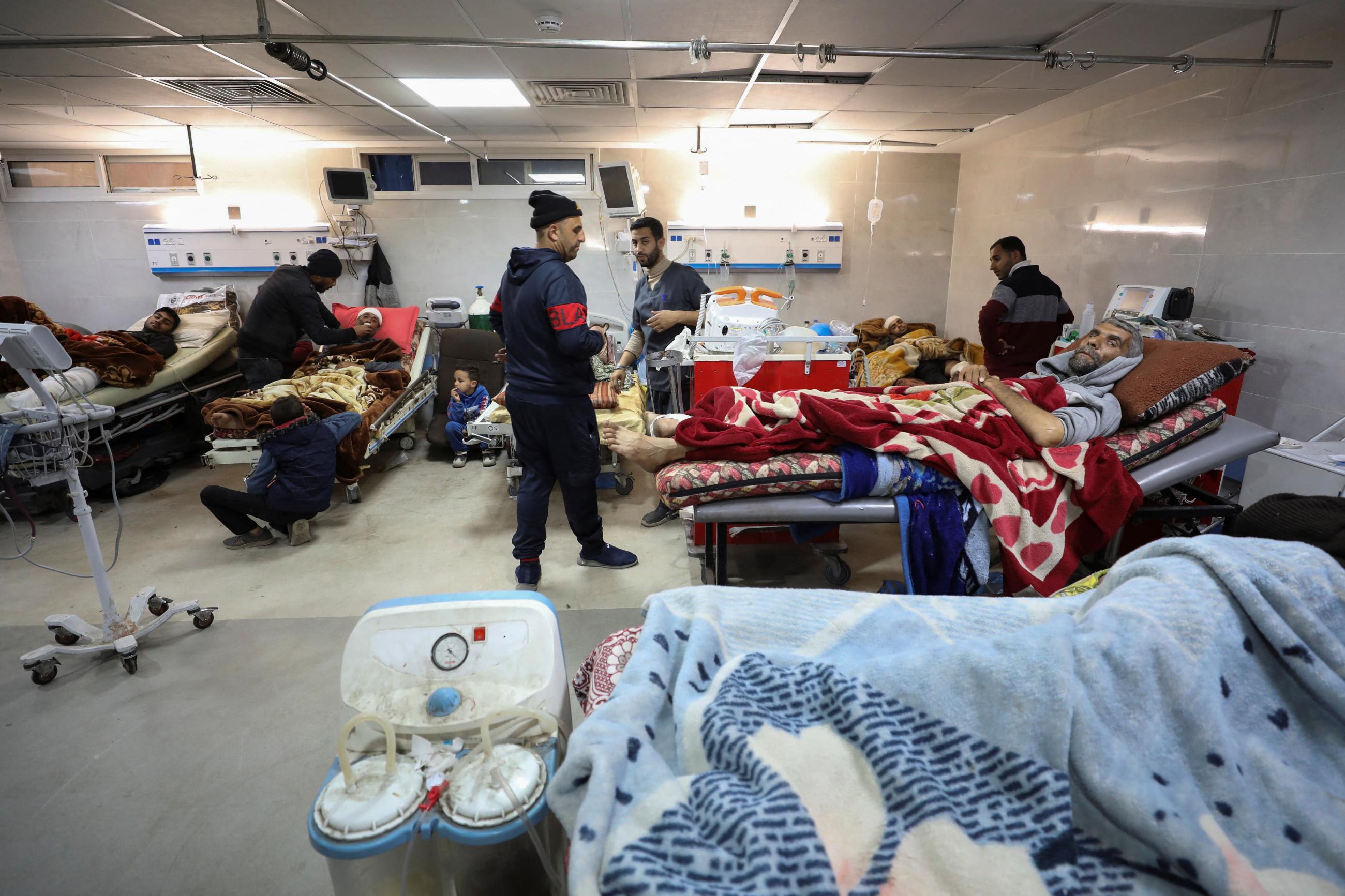 Palestinians who were wounded in Israeli fire while waiting for aid.