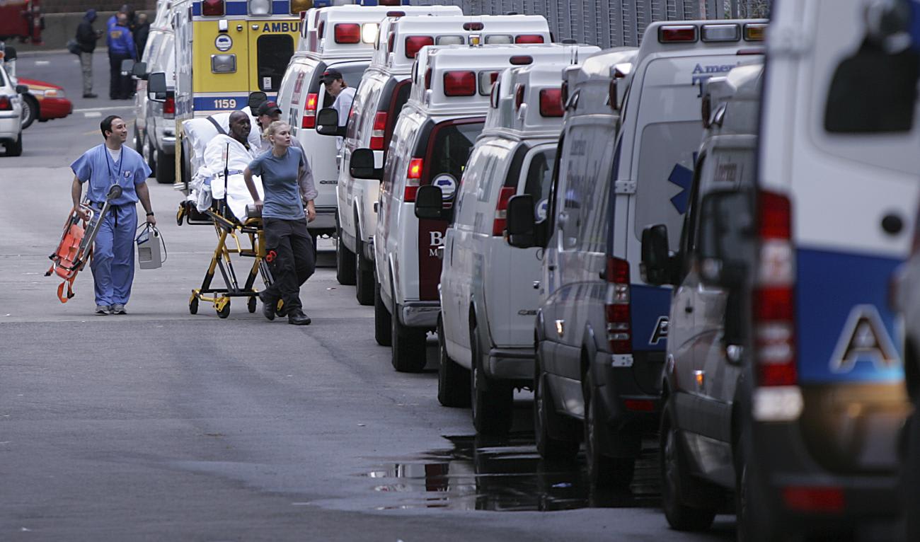 A patient is wheeled out of Bellevue Hospital during an evacuation in the aftermath of Hurricane Sandy.