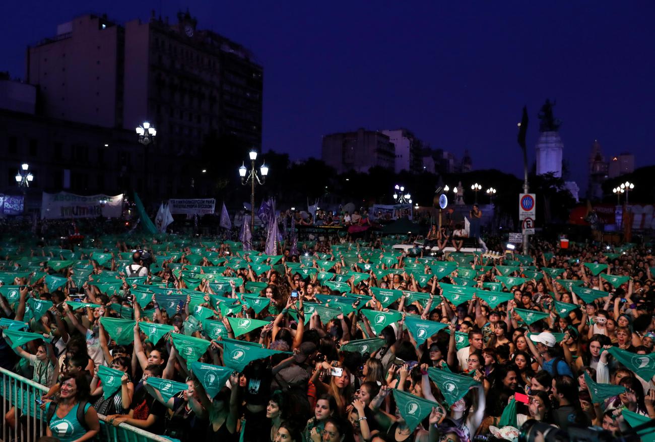 Activists hold green handkerchiefs, symbolizing the abortion rights movement, during a rally to legalize abortion outside the National Congress.