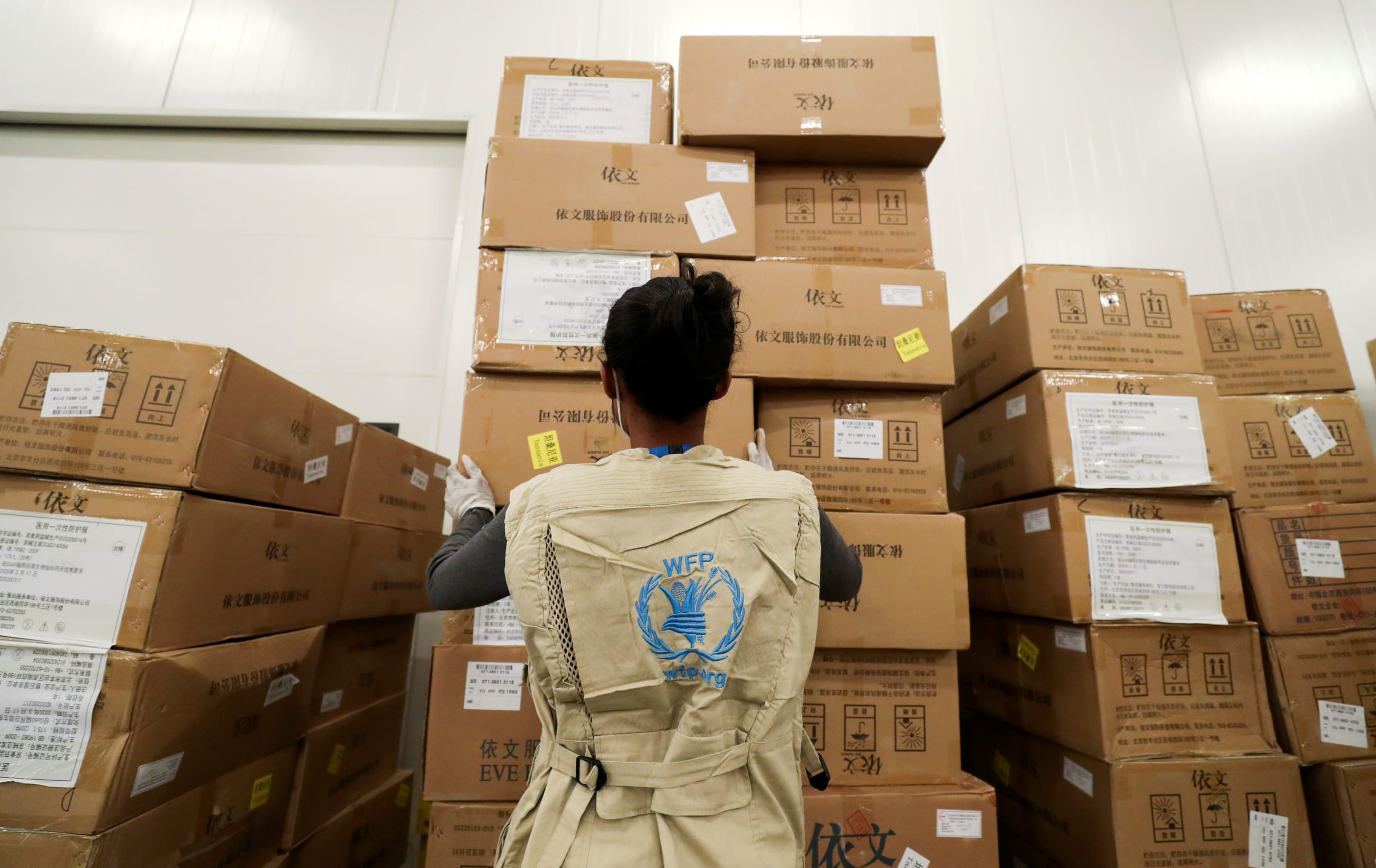 A World Food Program worker arranges relief packages designated to the United Nations for humanitarian aid for Africa to combat the outbreak of COVID-19.