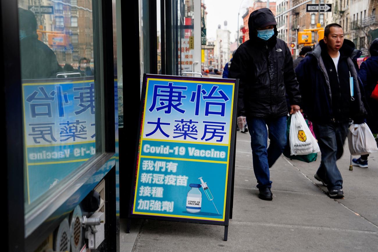 Chinese-language signage for COVID-19 vaccines sits outside of a pharmacy, New York City, New York, on February 12, 2023.