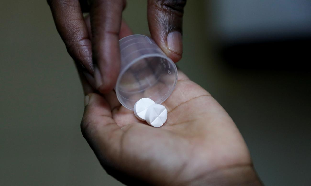 A nurse dispenses an antiretroviral drug used to prevent HIV from replicating to a child, at the Nyumbani Children's Home, Nairobi, Kenya, on February 12, 2025.