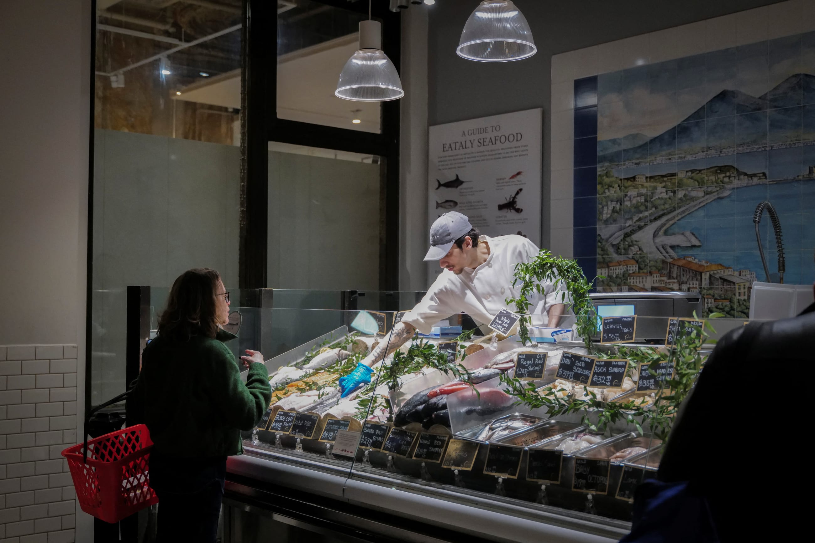 A woman shops for fish at a store, in New York City, on April 9, 2025.
