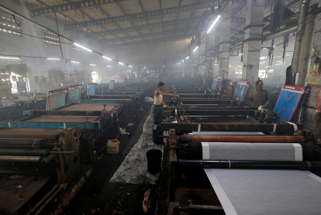 Employees work inside a sari manufacturing factory, in Surat, India, on March 8, 2019. 