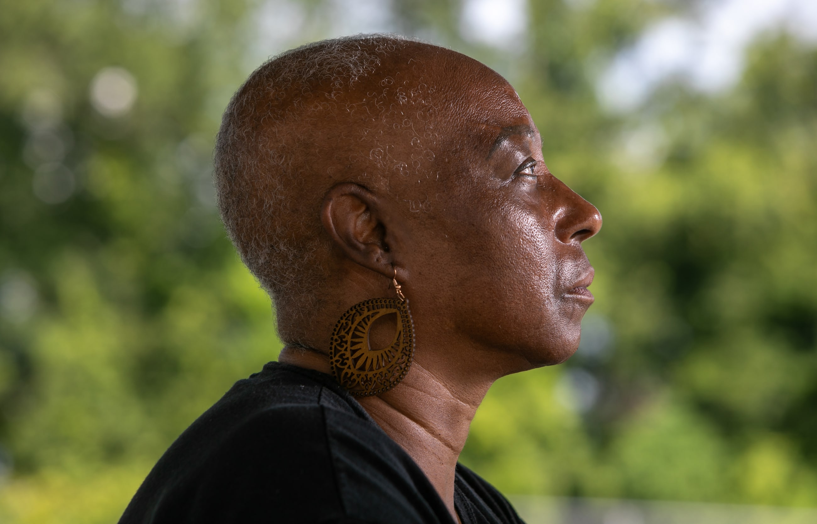 Veronica Jones, a survivor of aggressive breast cancer walks her neighborhood in Convent, Louisiana, Thursday June 26, 2025.