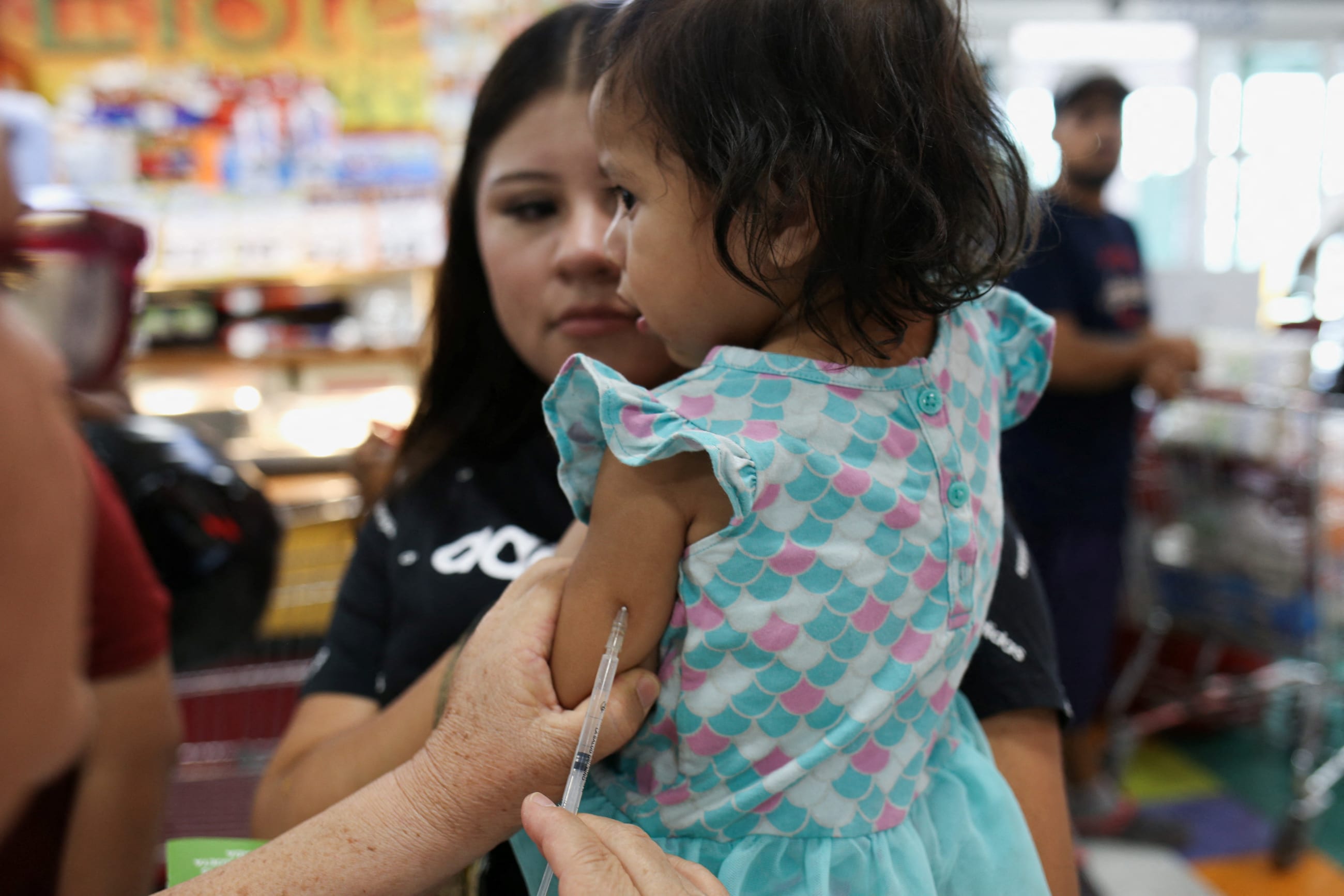 A health worker administers a dose of the measles vaccine to a girl during a vaccination drive in Ciudad Juarez, Mexico, June 15, 2025. 
