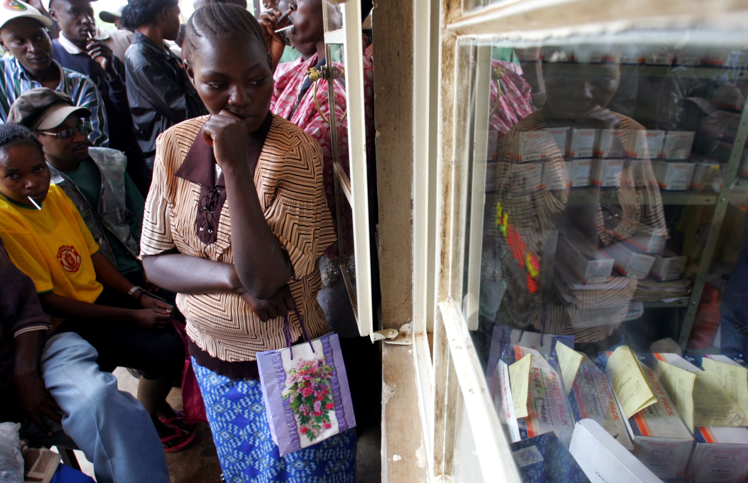 People wait for their anti-tuberculosis drugs, near Nairobi, Kenya, on March 23, 2006.