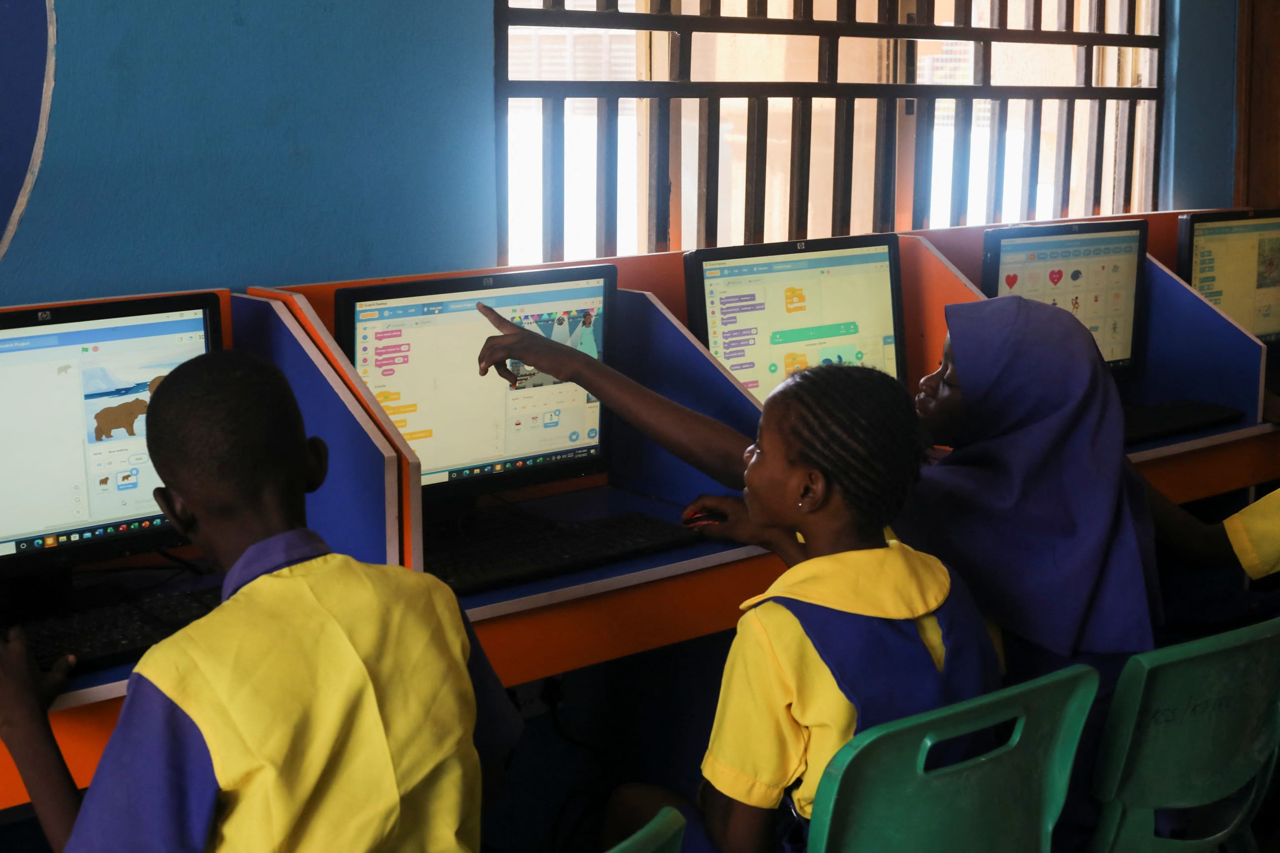 Students enrolled in a special STEM program for children from poor families attend a computer, in Abuja, Nigeria, on February 18, 2022. 
