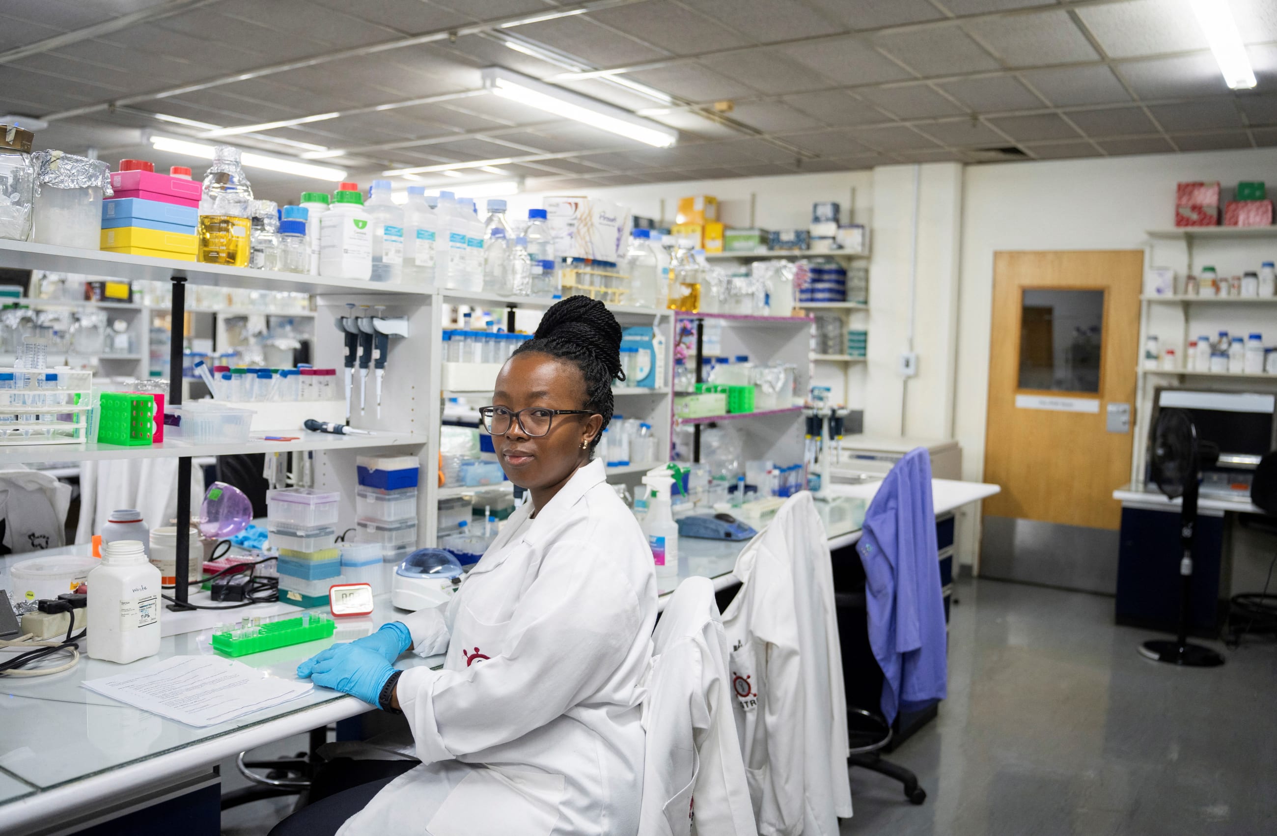 A medical laboratory technician at the Wits Antiviral Gene Therapy Research Unit poses for a portrait, in the research lab at the Wits University Faculty of Health Sciences, in Johannesburg, South Africa, on February 14, 2025.
