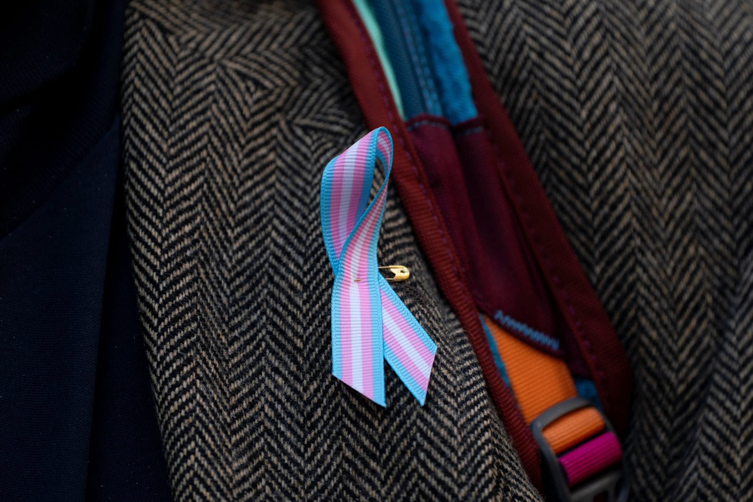 A supporter wears a pro-trans ribbon, in Seattle, Washington, on February 28, 2025.