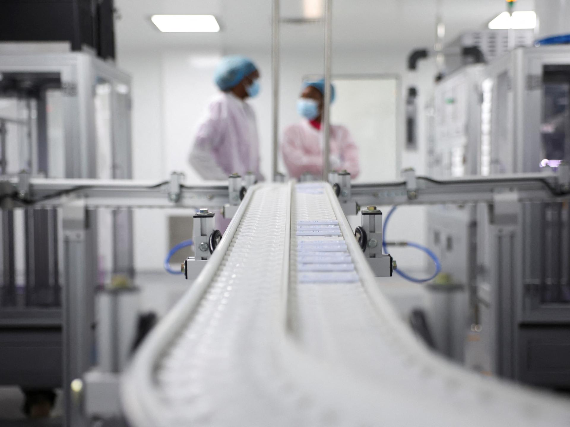 Plastic test cassettes for HIV 1/2 roll on a machine at Codix Bio production plant where HIV and Malaria test kits are locally produced, in Iperu-Remo, in Ogun State, Nigeria, on June 18, 2025.