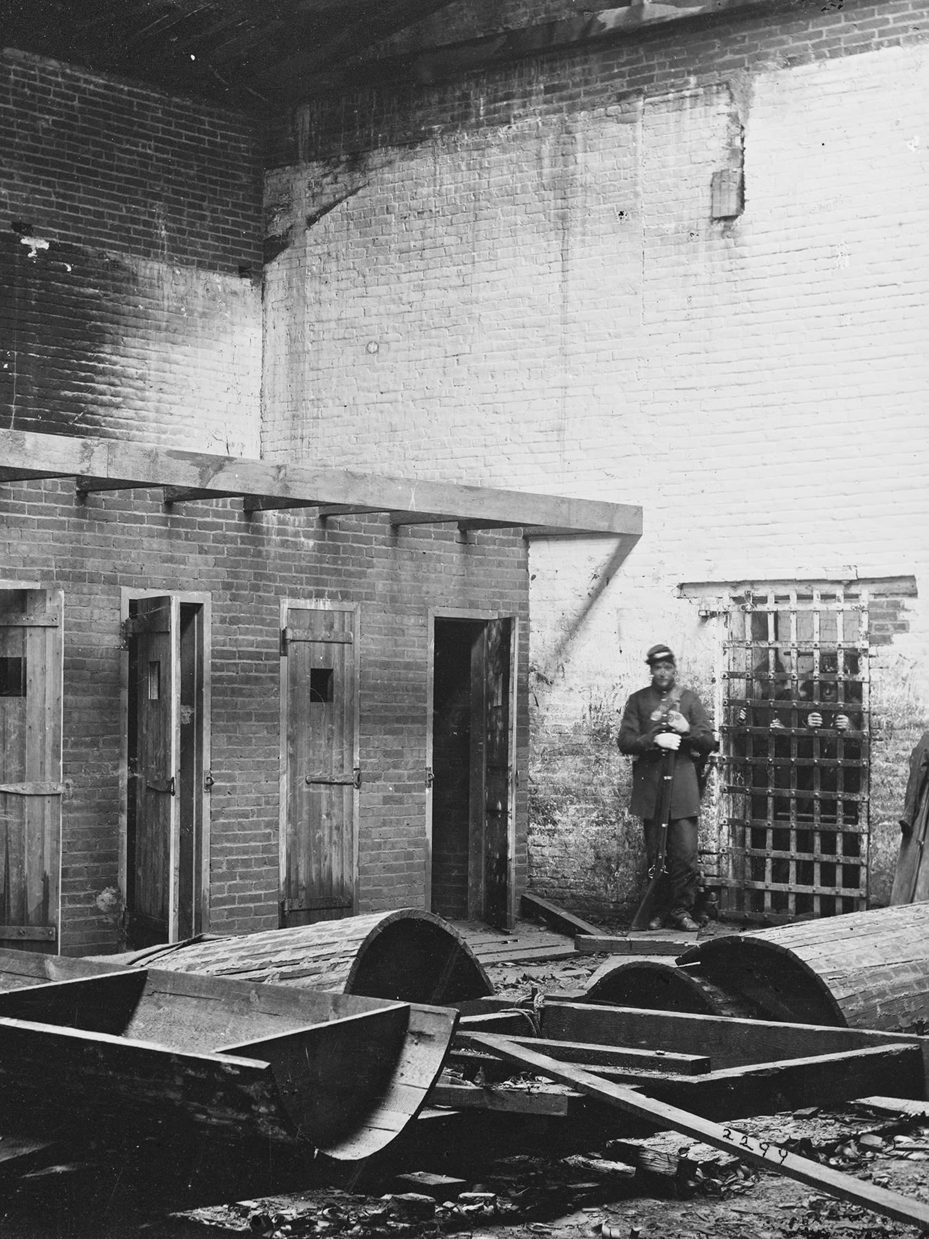 The photo shows an interior of the captured pen with a union soldier in the picture.