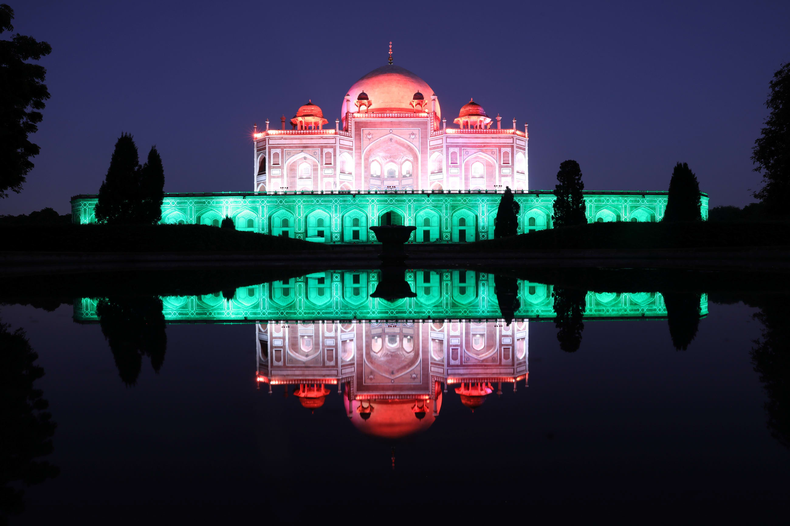 Humayun's Tomb lit up in pink and green to celebrate India’s milestone of administering one billion COVID-19 vaccine doses, in New Delhi, India, on October 21, 2021.