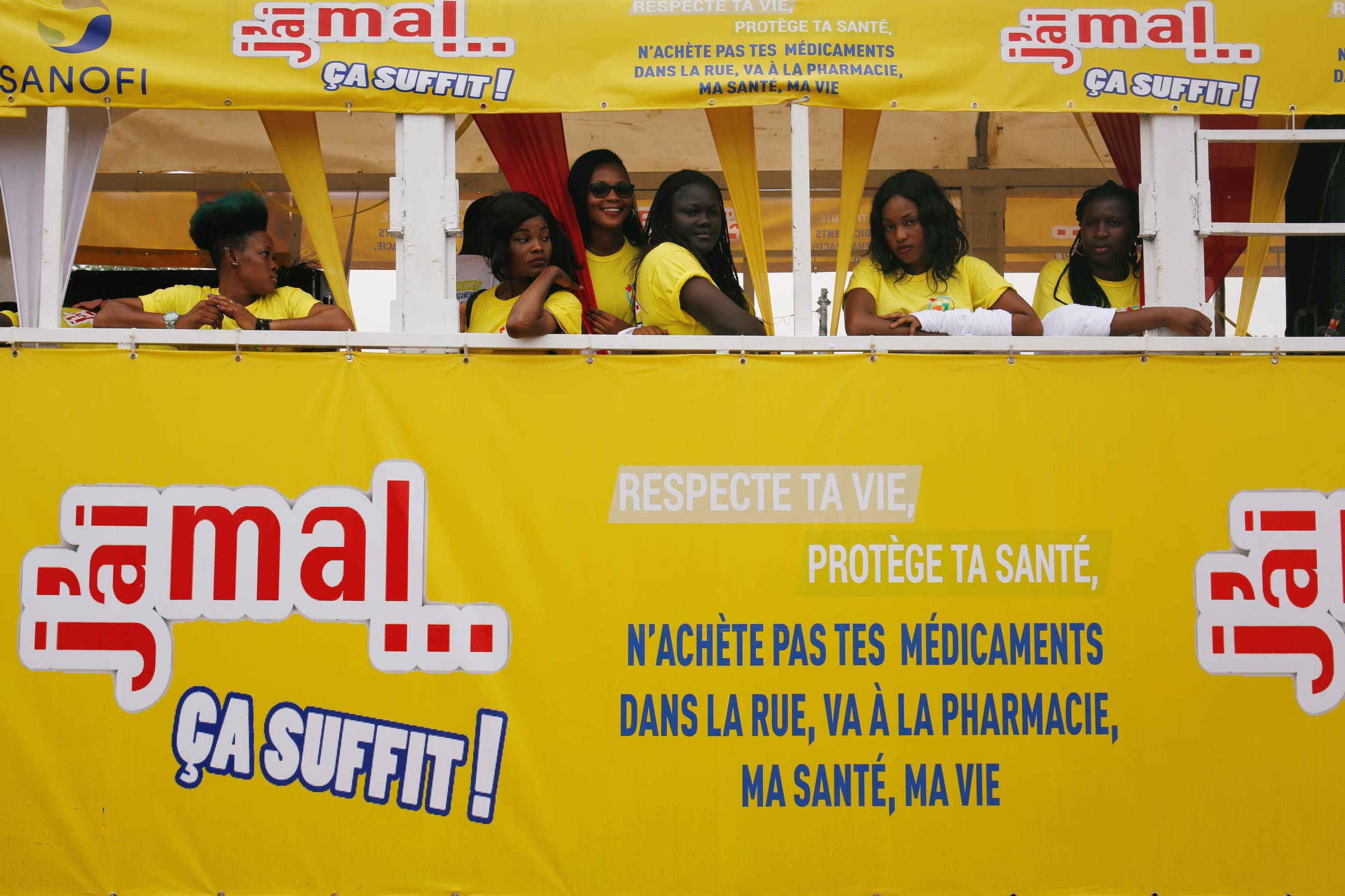 Girls stand in a truck during a campaign to raise awareness about illegal and false drugs in Abobo, a suburb of Abidjan, Ivory Coast, on October 11, 2018.