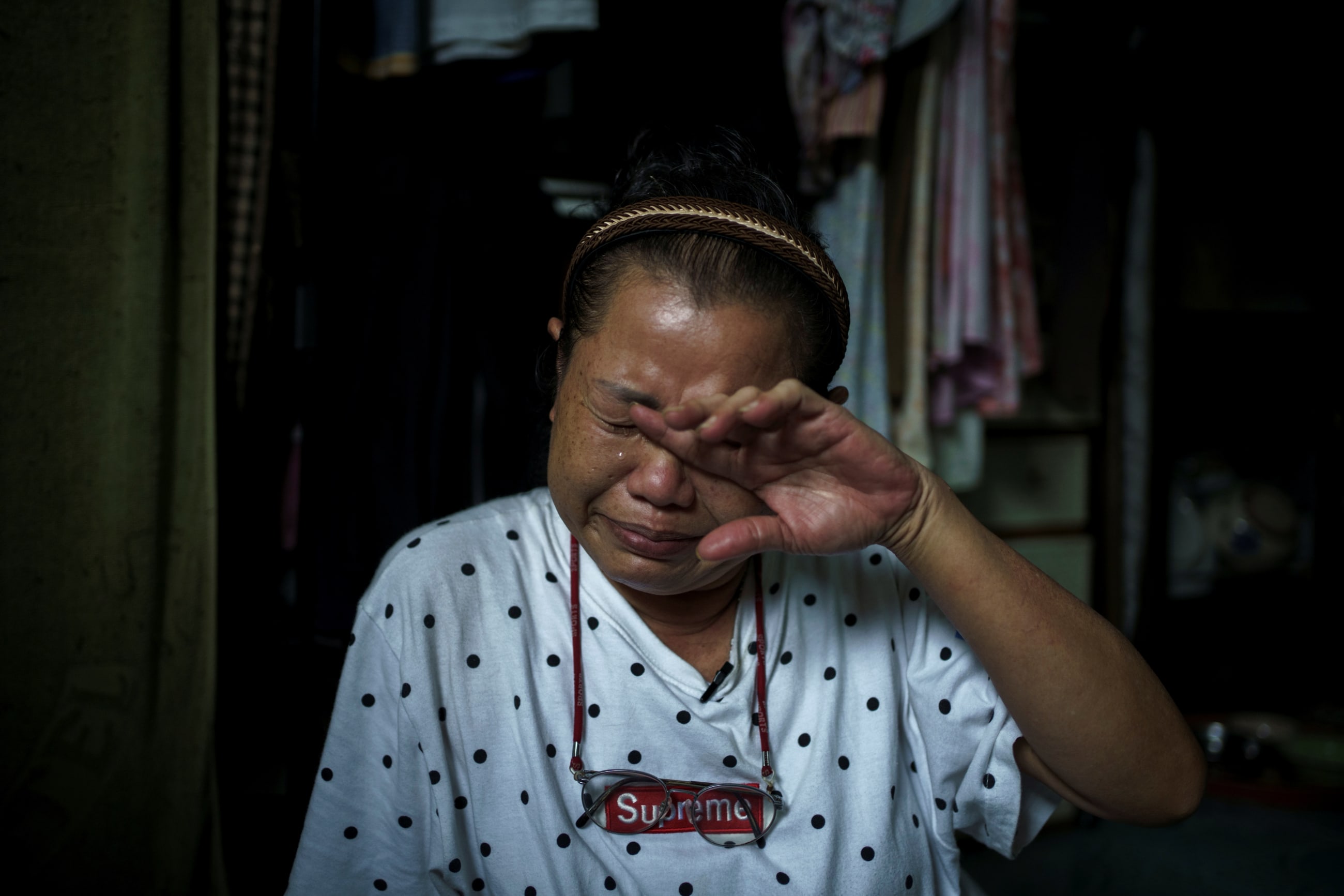 who survived after she tried to take her own life in April outside Thailand's finance ministry building, during the coronavirus disease (COVID-19) outbreak, cries during an interview with Reuters, at her home in Samut Sakhon province, Thailand, May 29, 2020.