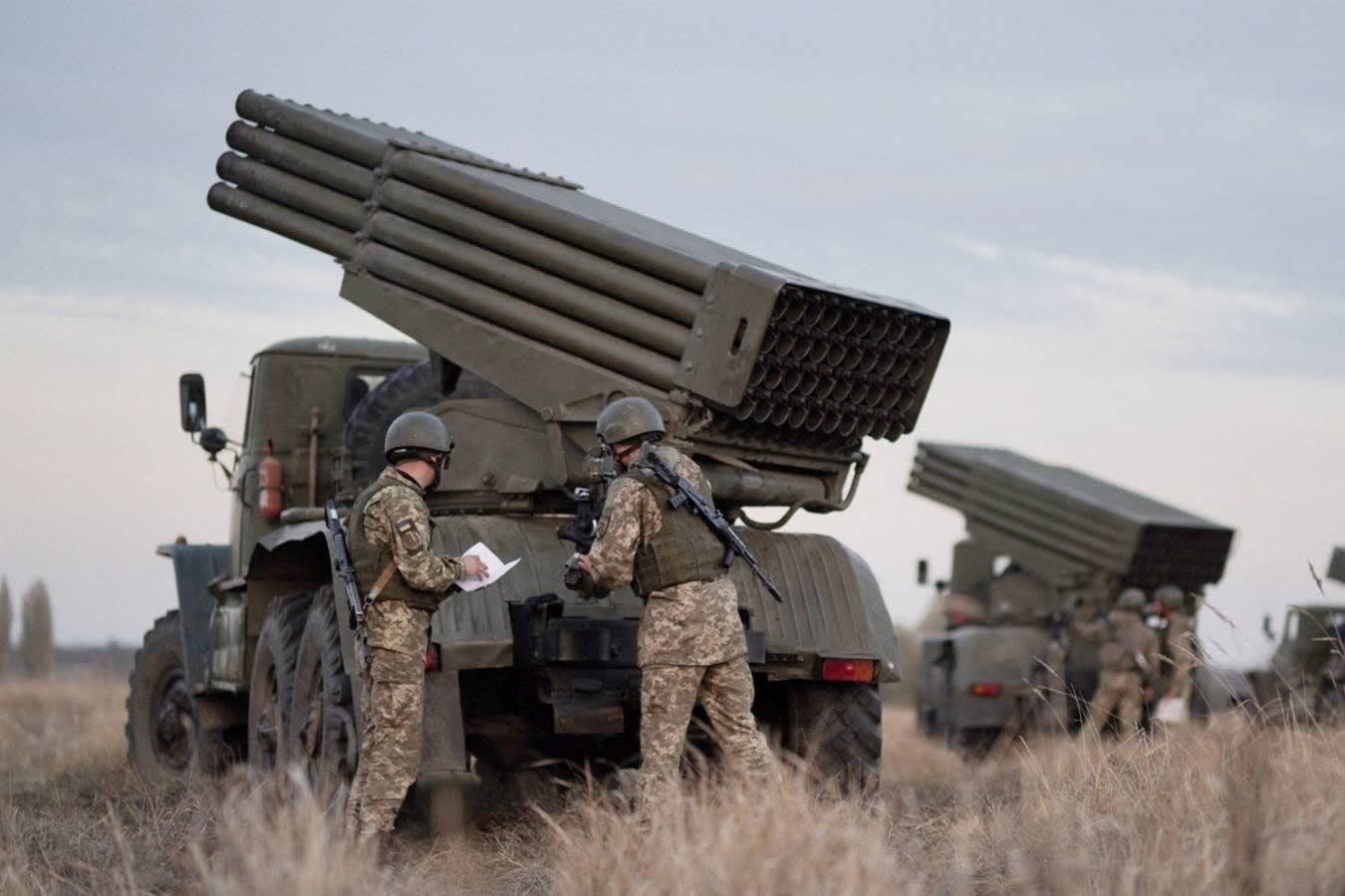 Service members of the Ukrainian Armed Forces gather near BM-21 "Grad" multiple rocket launchers during tactical military exercises at a shooting range in the Kherson region, Ukraine, January 19, 2022.