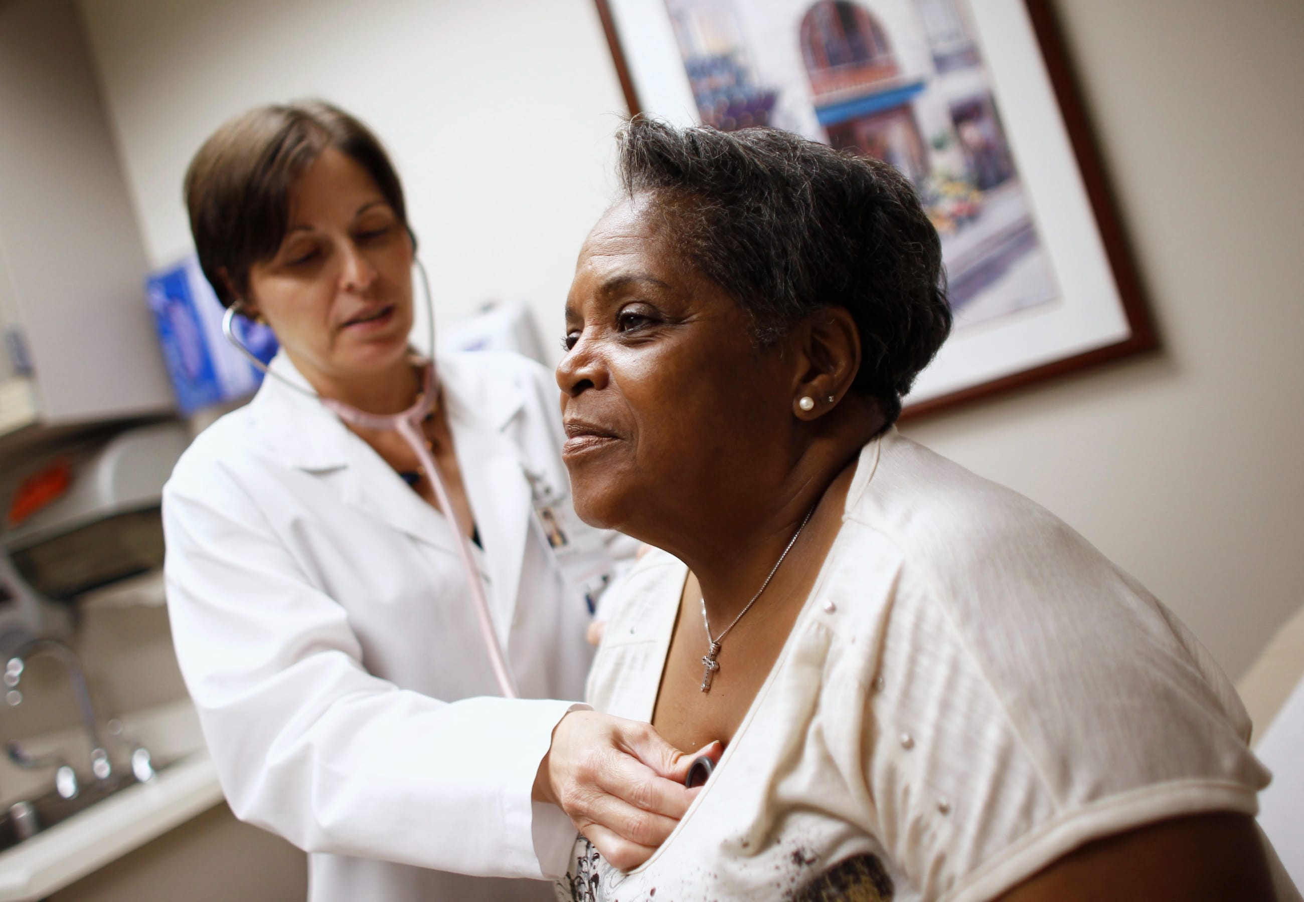 A woman receives a checkup from a doctor in Chicago, Illinois.