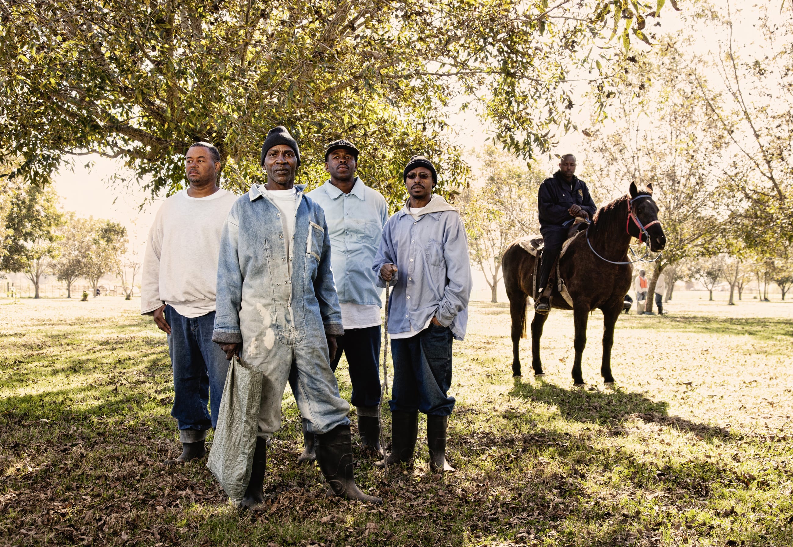 Jimmy Jackson, age 63, at the front of the group in the Pecan Field at Angola.