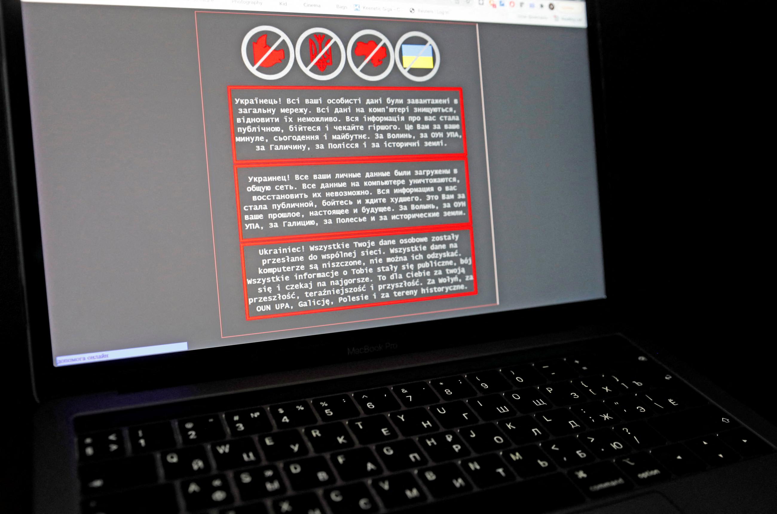 A&nbsp;laptop&nbsp;screen&nbsp;displays a warning message in Ukrainian, Russian and Polish, that appeared on the official website of the Ukrainian Foreign Ministry after a massive cyberattack, in this illustration taken January 14, 2022.