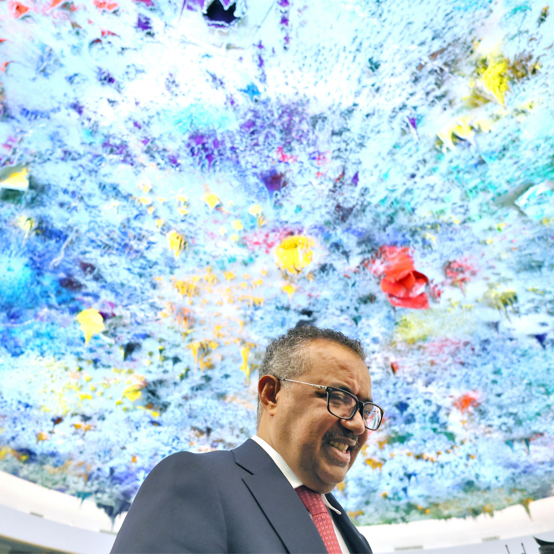 A blue, purple, and yellow skylight hovers above Dr. Tedros Adhanom Ghebreyesus, director-general of the World Health Organization (WHO) celebrates his re-election during the 75th World Health Assembly at the United Nations in Geneva, Switzerland, May 24, 2022.