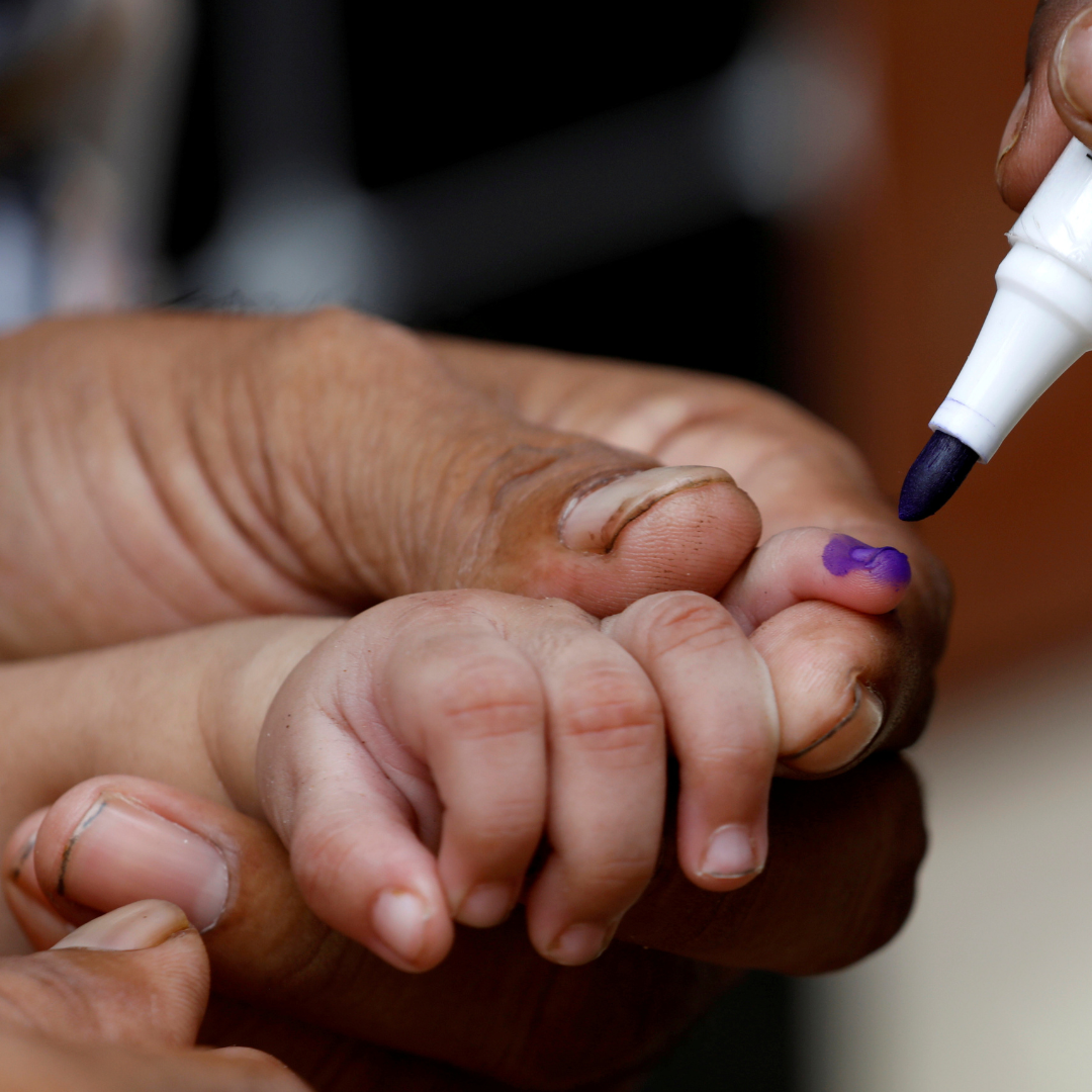 A close-up image of a child's hand being marked with a purple pen after he is administered polio vaccine drops, during an anti-polio campaign in Karachi, Pakistan, on July 20, 2020.
