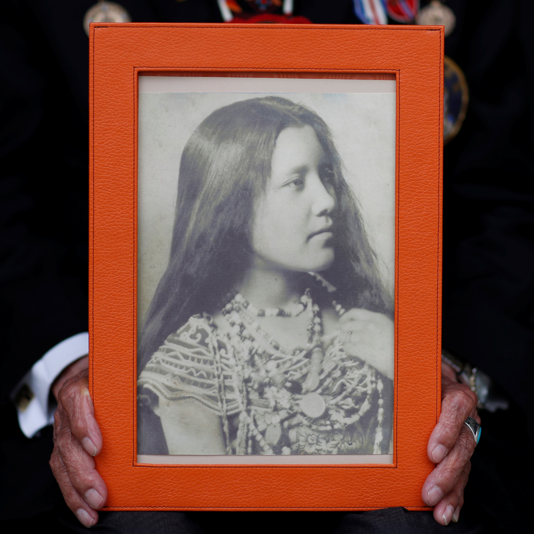 A close-up of the hands of Charles Norman Shay, a member of the Penobscot Nation and a World War II veteran, holding a picture of his mother Florence. Photo taken in Bretteville l'Orgueilleuse, France, on May 18, 2019.