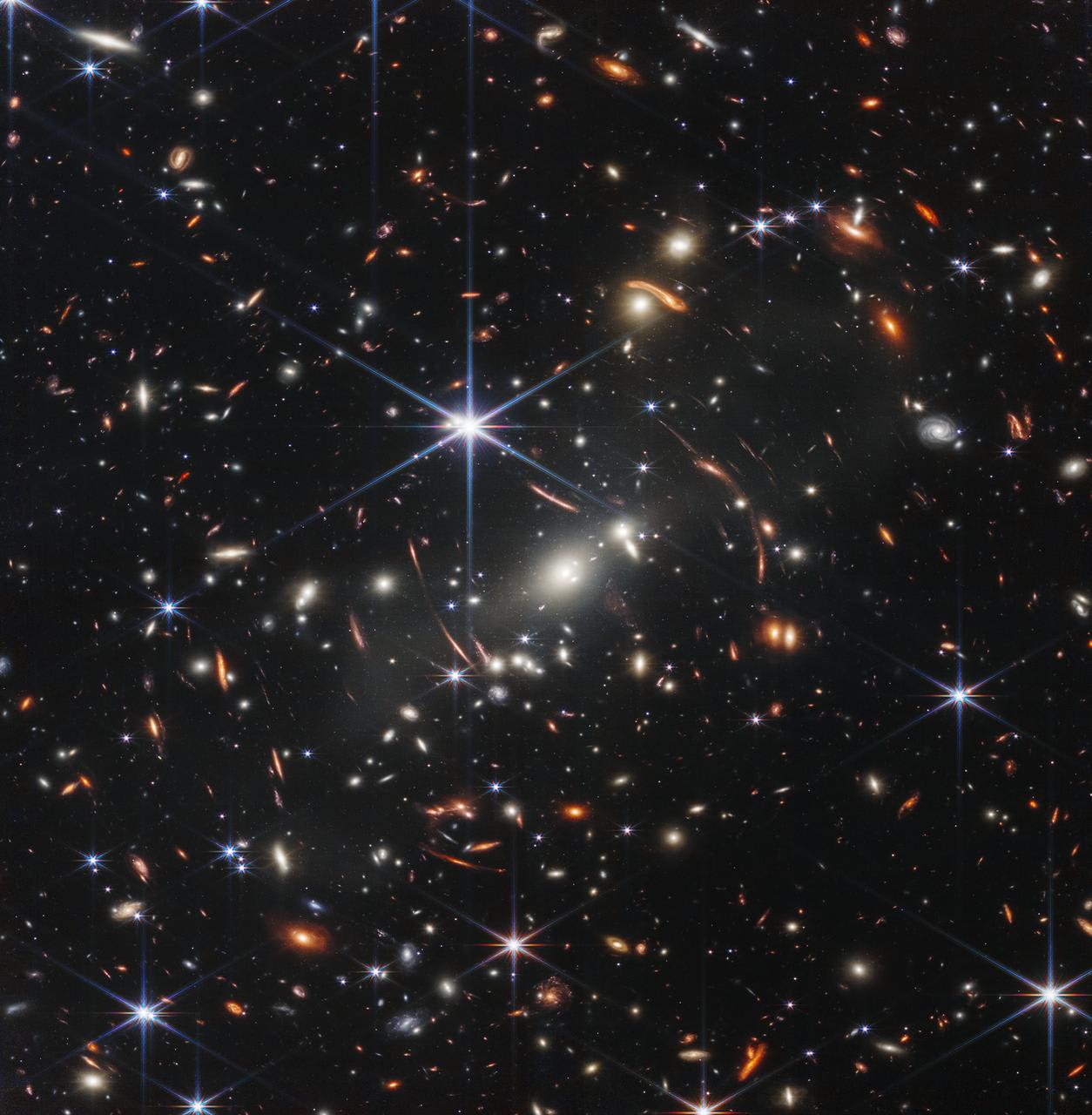 Thousands of galaxies flood this near-infrared image of galaxy cluster SMACS 0723. High-resolution imaging from NASA’s James Webb Space Telescope combined with a natural effect known as gravitational lensing made this finely detailed image possible.
