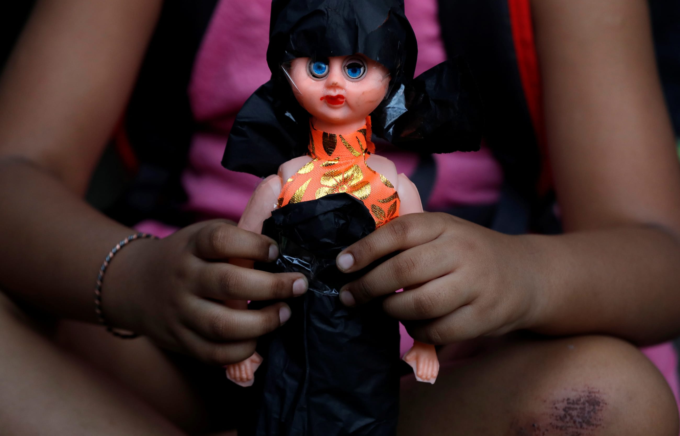 A child attends a protest against the rape of an eight-year-old girl in Kathua, near Jammu, and a teenager in Unnao, Uttar Pradesh state, in New Delhi, India, on April 15, 2018.