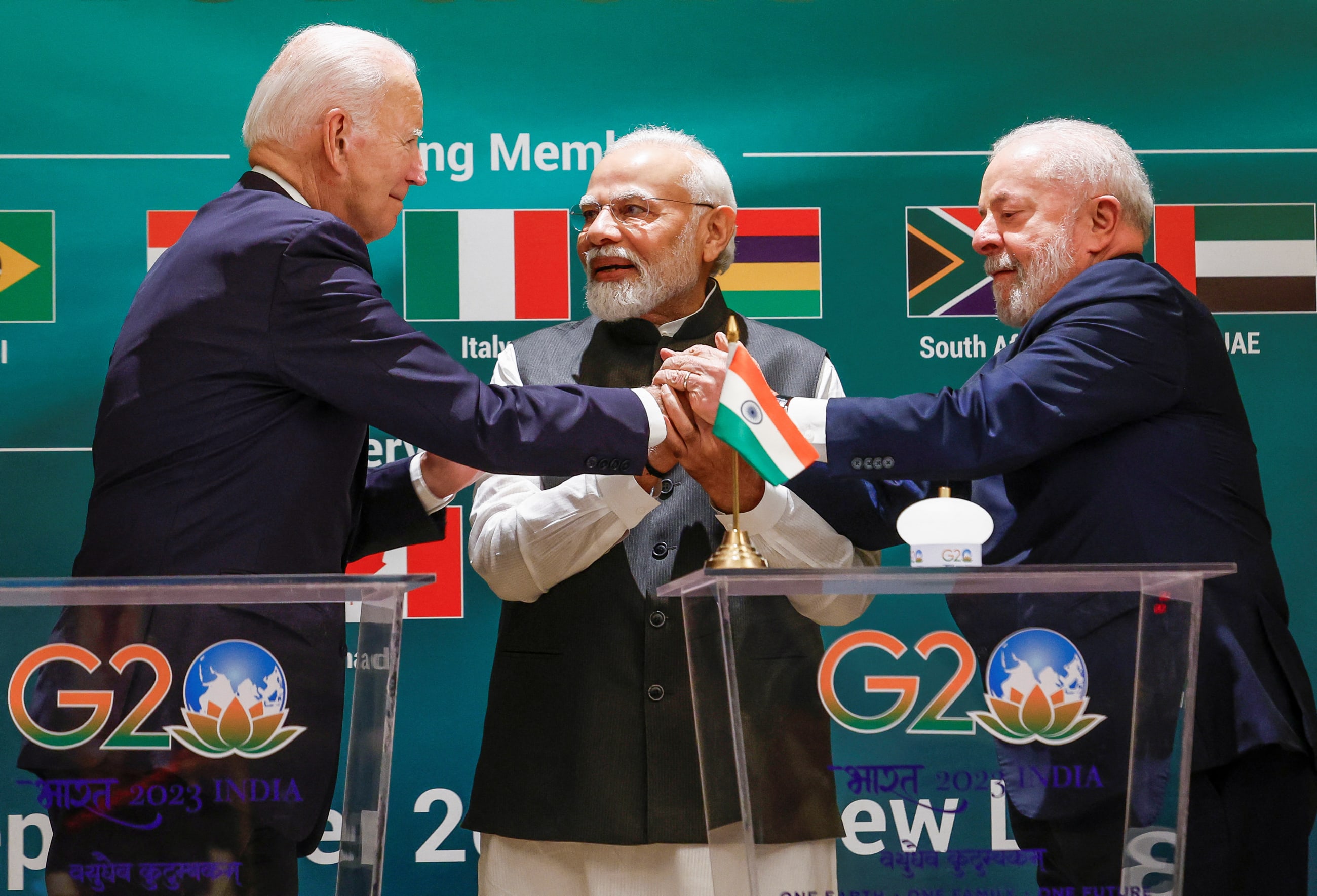 U.S. President Joe Biden, Indian Prime Minister Narendra Modi ,and Brazilian President Luiz Inacio Lula da Silva hold hands as they attend the launch of the Global Biofuels Alliance at the G20 summit in New Delhi, India, September 9, 2023.