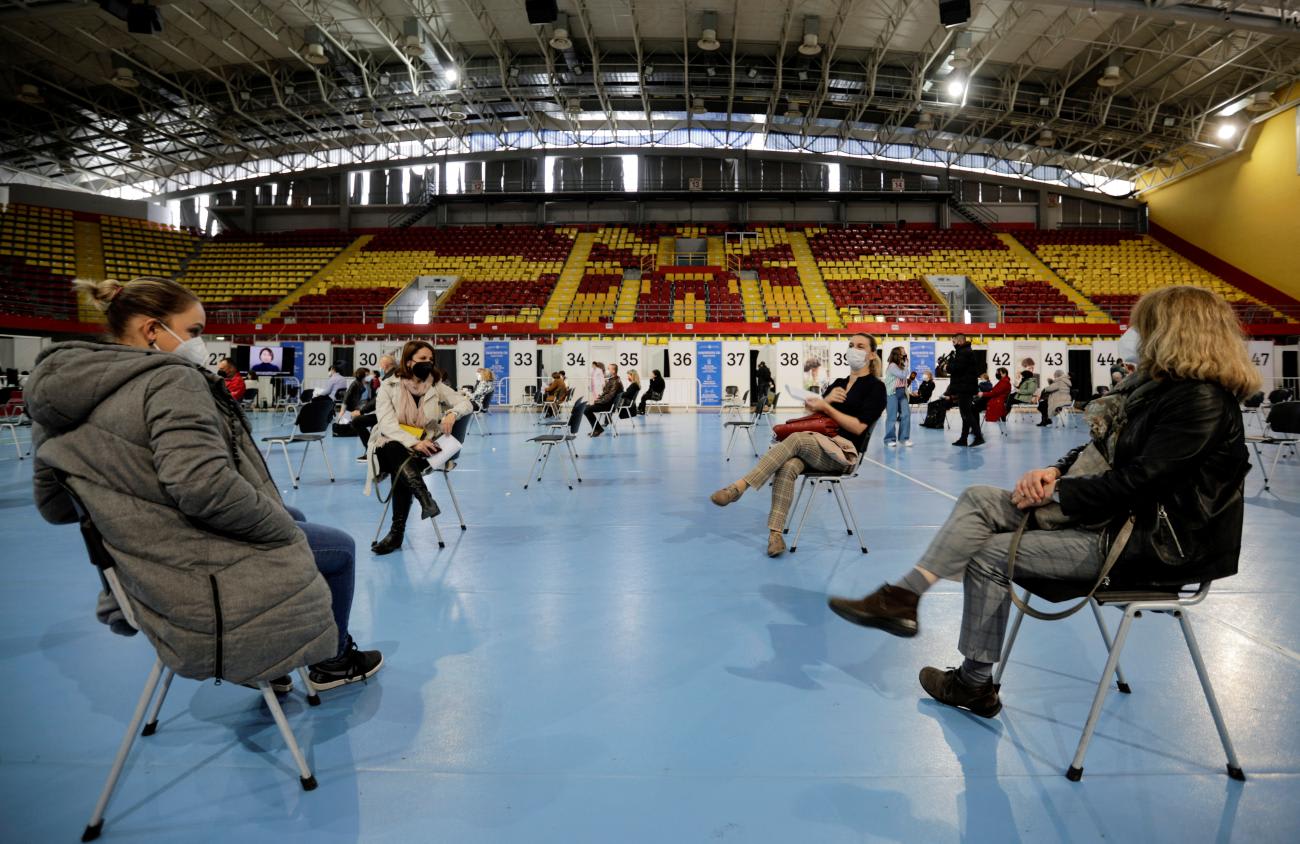People rest after receiving a dose of Russia's Sputnik V COVID-19&nbsp;vaccine&nbsp;at a sport center.