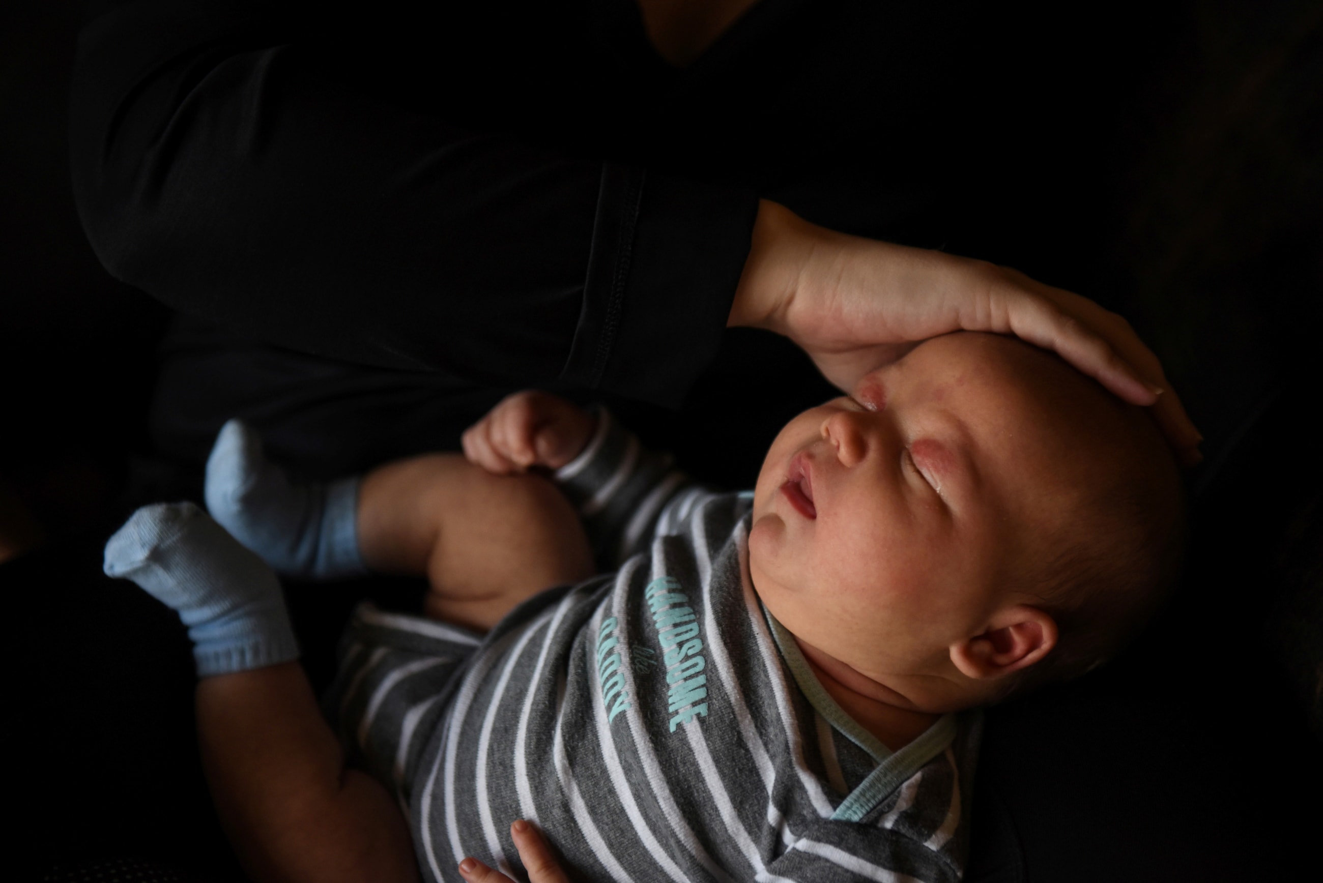 Lauren Hoffmann, 29, holds her son during her last week of maternity leave
