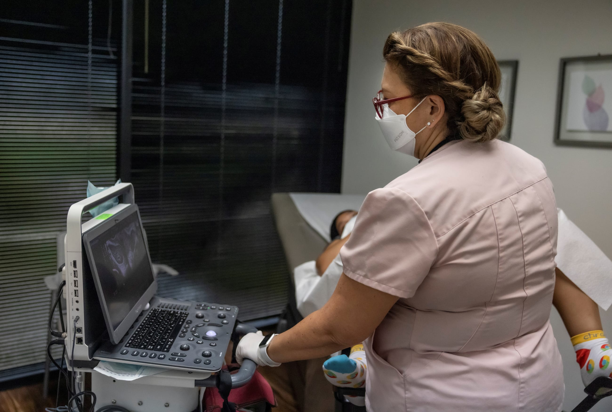 Catalina Leano, a licensed vocational nurse at Houston Women's Reproductive Services, performs an ultrasound with the clinic doctor present