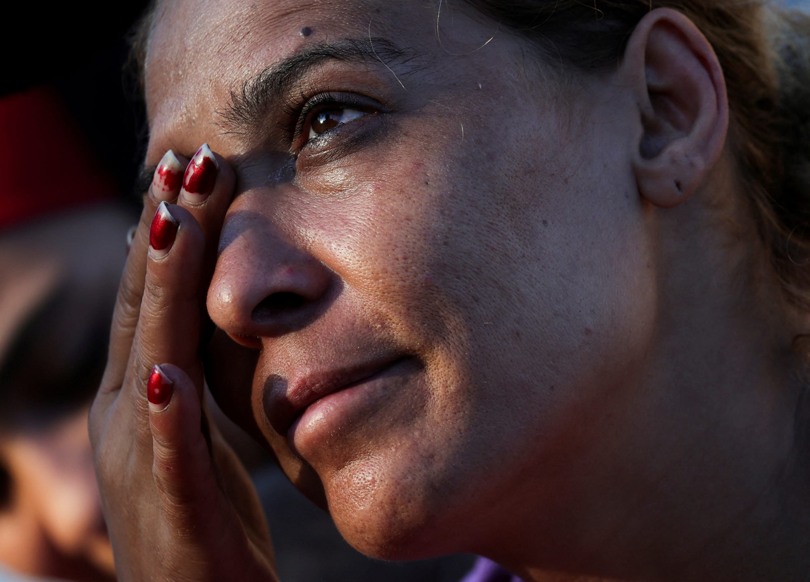 Amira, reacts during an interview at Beirut's central Martyrs' Square where many families fled from the Israeli strikes in southern Beirut.