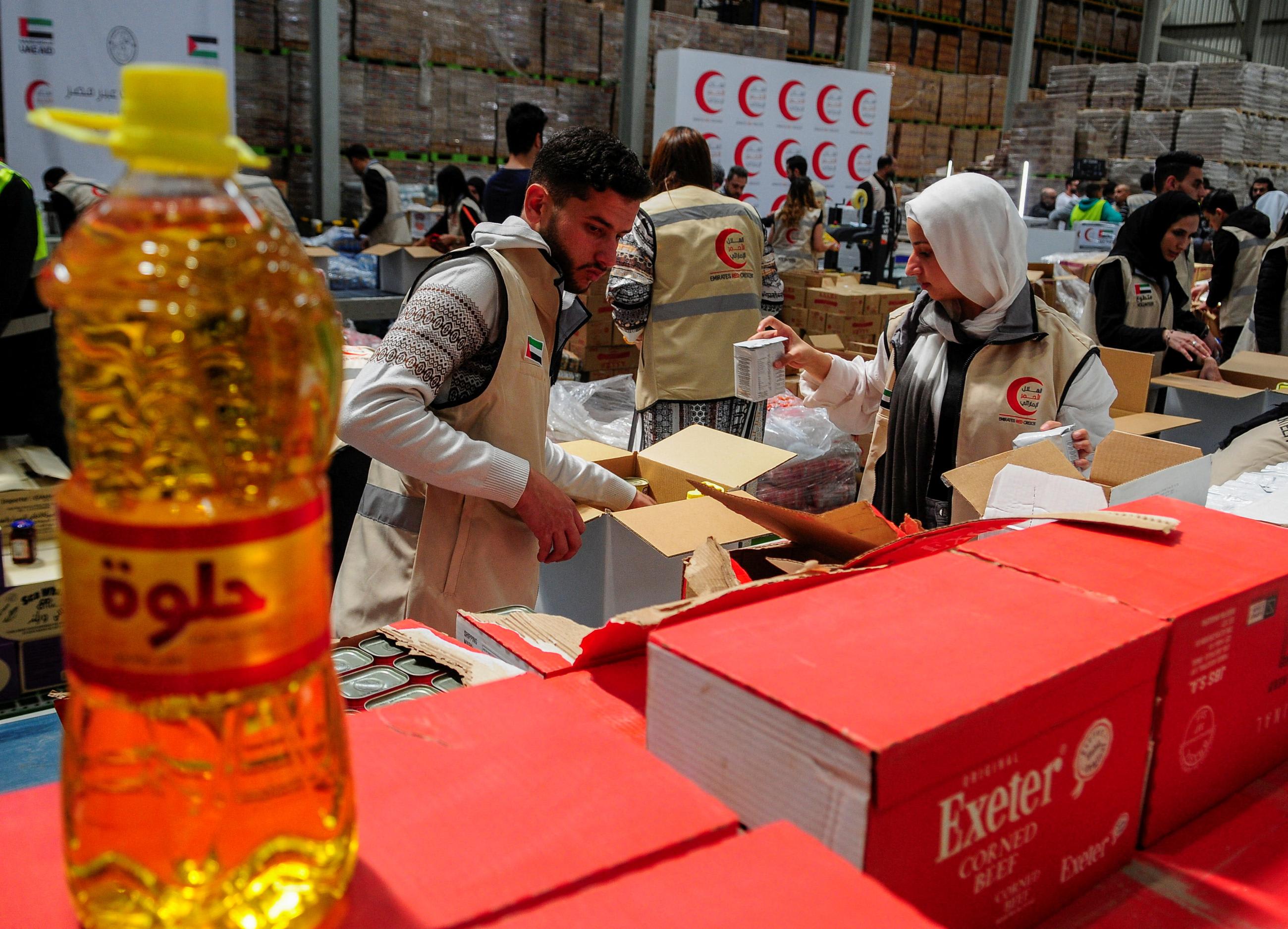Volunteers from Emirates Red Crescent prepare parcels with&nbsp;humanitarian&nbsp;aid&nbsp;for&nbsp;Gaza&nbsp;to be transferred through the Rafah border crossing.