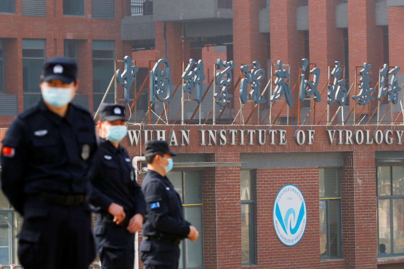 Security personnel keep watch outside Wuhan Institute of Virology during the visit by the WHO team tasked with investigating the origins of COVID-19, in&nbsp;Wuhan,&nbsp;China, on&nbsp;February 3, 2021.