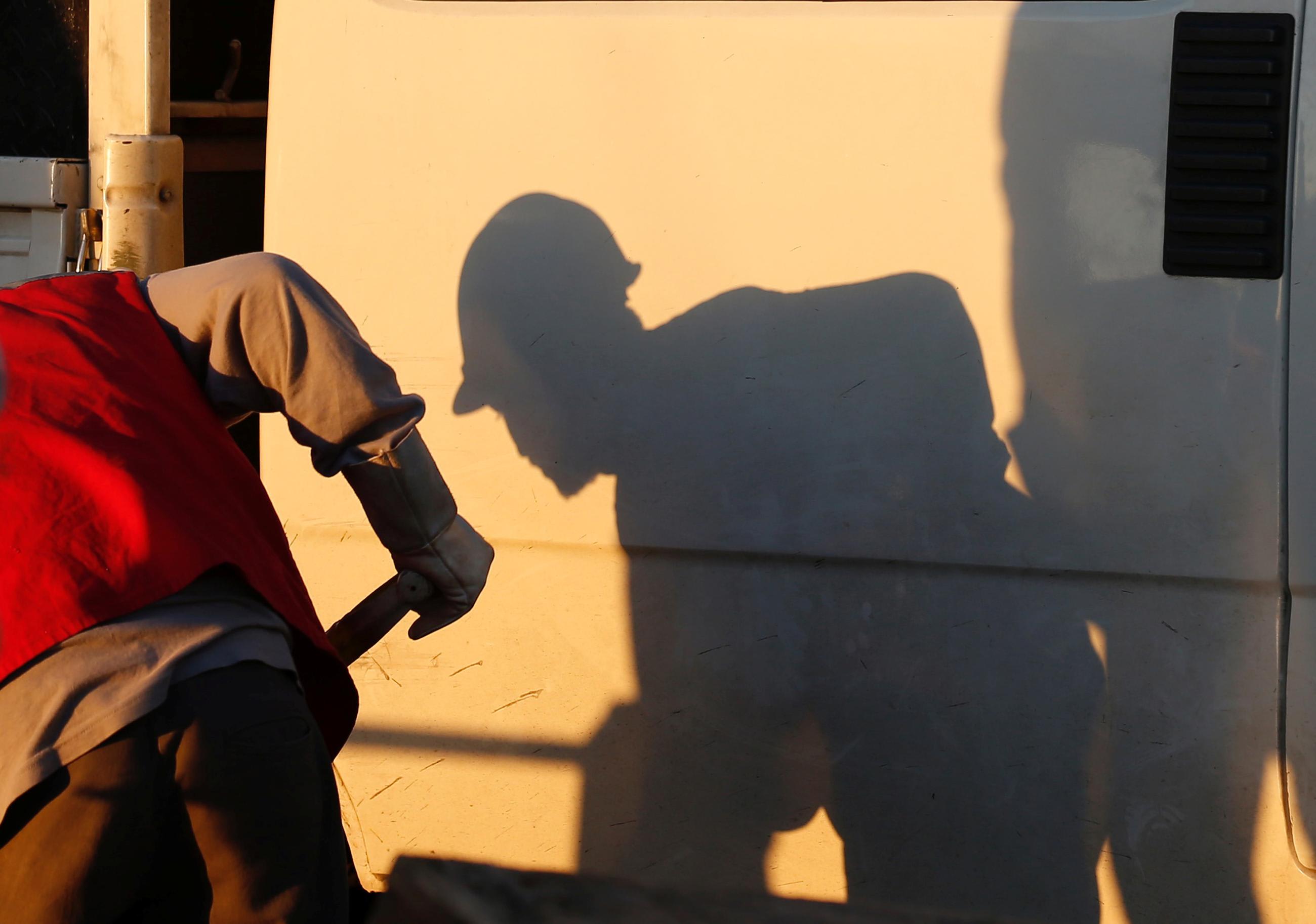 The shadow of a laborer working is seen at a&nbsp;construction&nbsp;site of a future urban project, in Valparaiso, Chile, on May 25, 2017. 