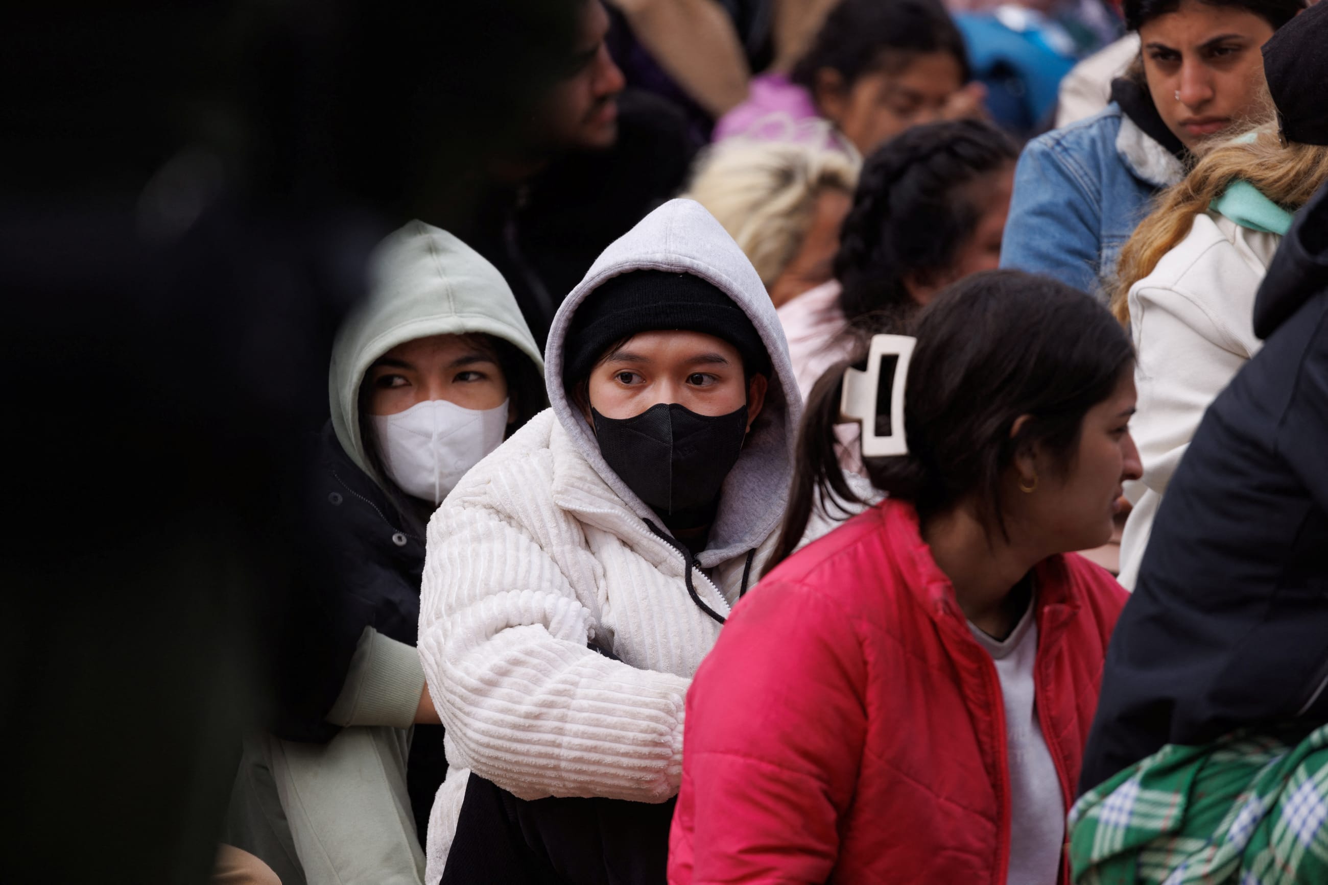 Migrants gather between primary and secondary border fences as the United States prepares to lift COVID-19 era Title 42 restrictions, near San Diego, California, on May 10, 2023.