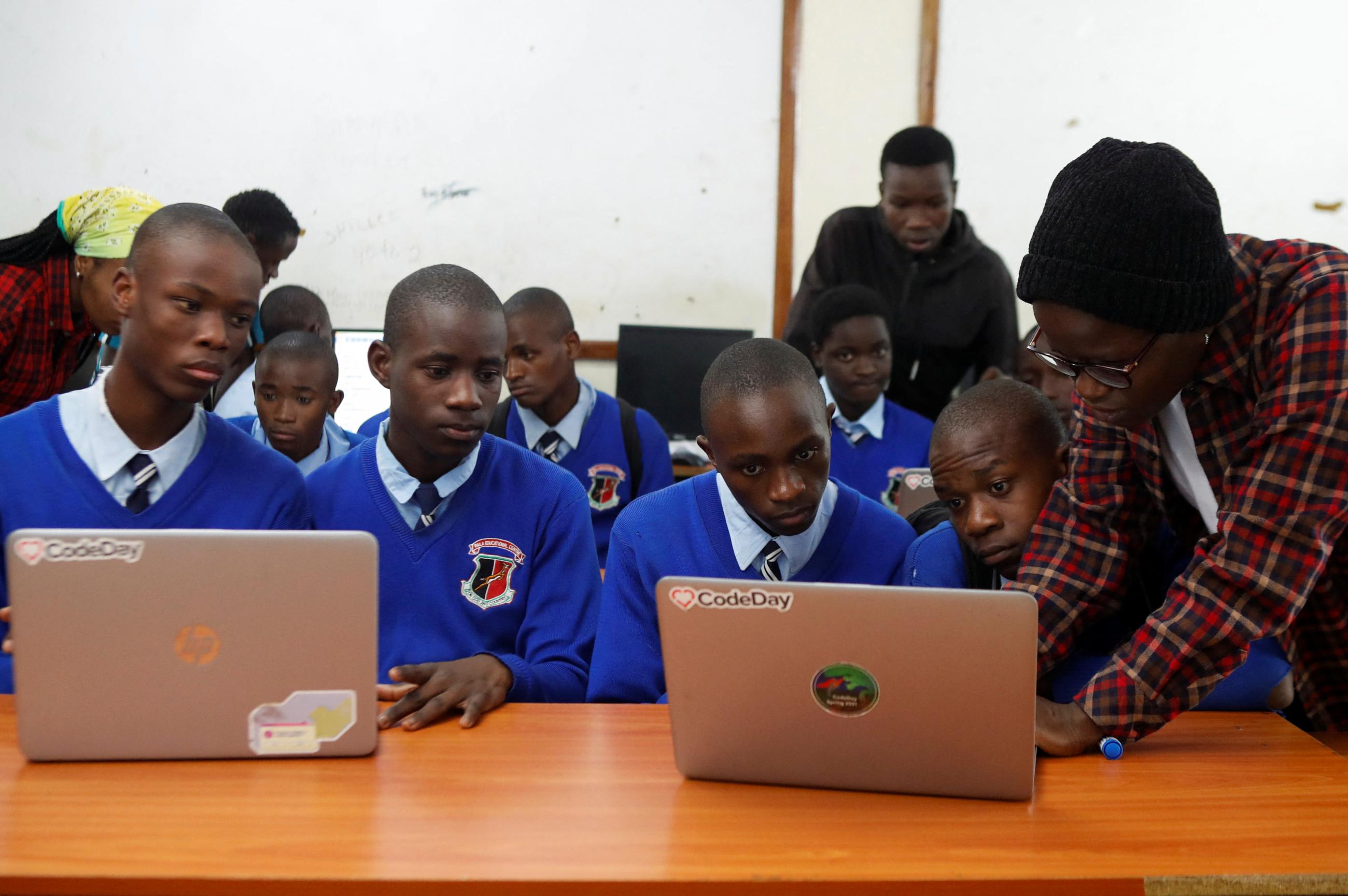Renice Owino, founder of Code with Kids, instructs students on a laptop during a coding lesson, at the Raila&nbsp;Educational Centre, in Nairobi, Kenya, on May 31, 2023.